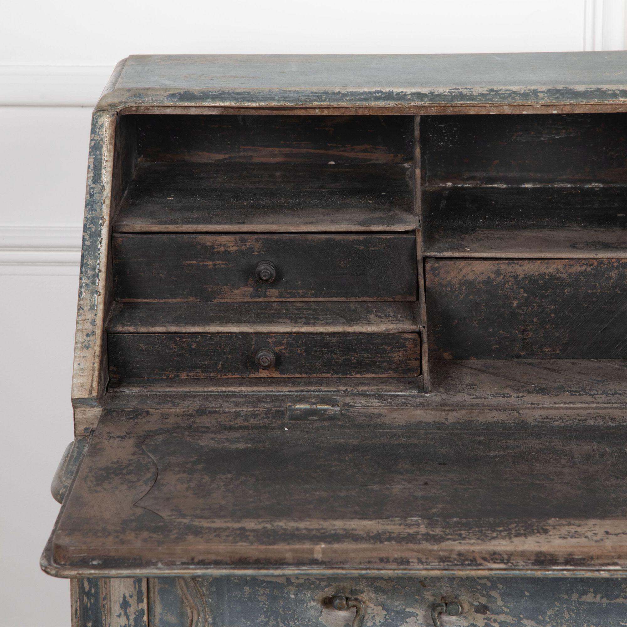 Beautiful and large scale late 18th century French bureau taken back to its original blue paint.
With a serpentine front and deeply moulded drawers, the fitted interior in old black paint.