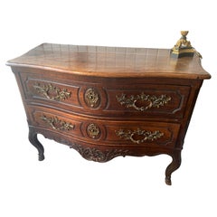 Antique 18th Century French serpentine front commode raised on legs with hooved feet