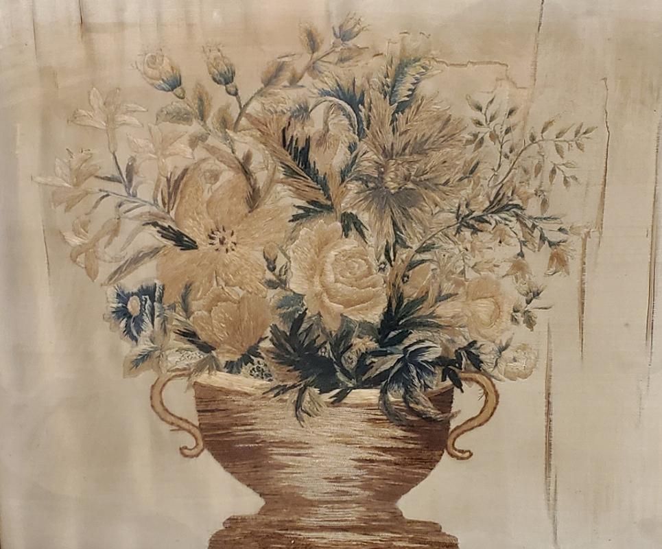 18th century French silk needlepoint picture in original gilt frame
Depicts flowers in an urn. 
France, circa 1780
Measures: 20