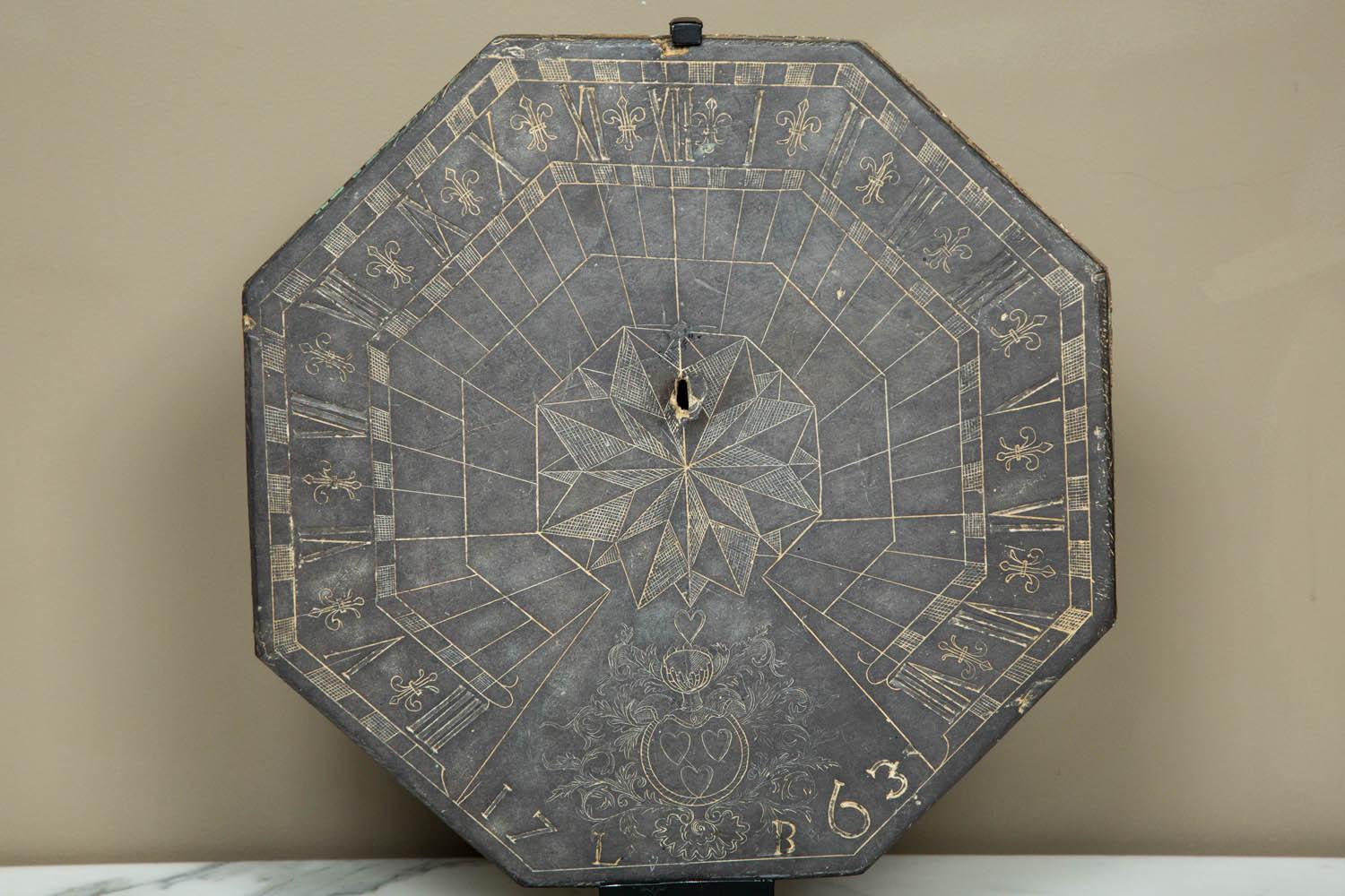A large and exceptionally well preserved 18th century slate French (or possibly Belgian, from Liege, Marres family) sundial dated 1763 and bearing an elaborate coat of arms and the initials LB.
Octagonal shape
Weight: circa 5 kg
Size: cm 35 x 35,