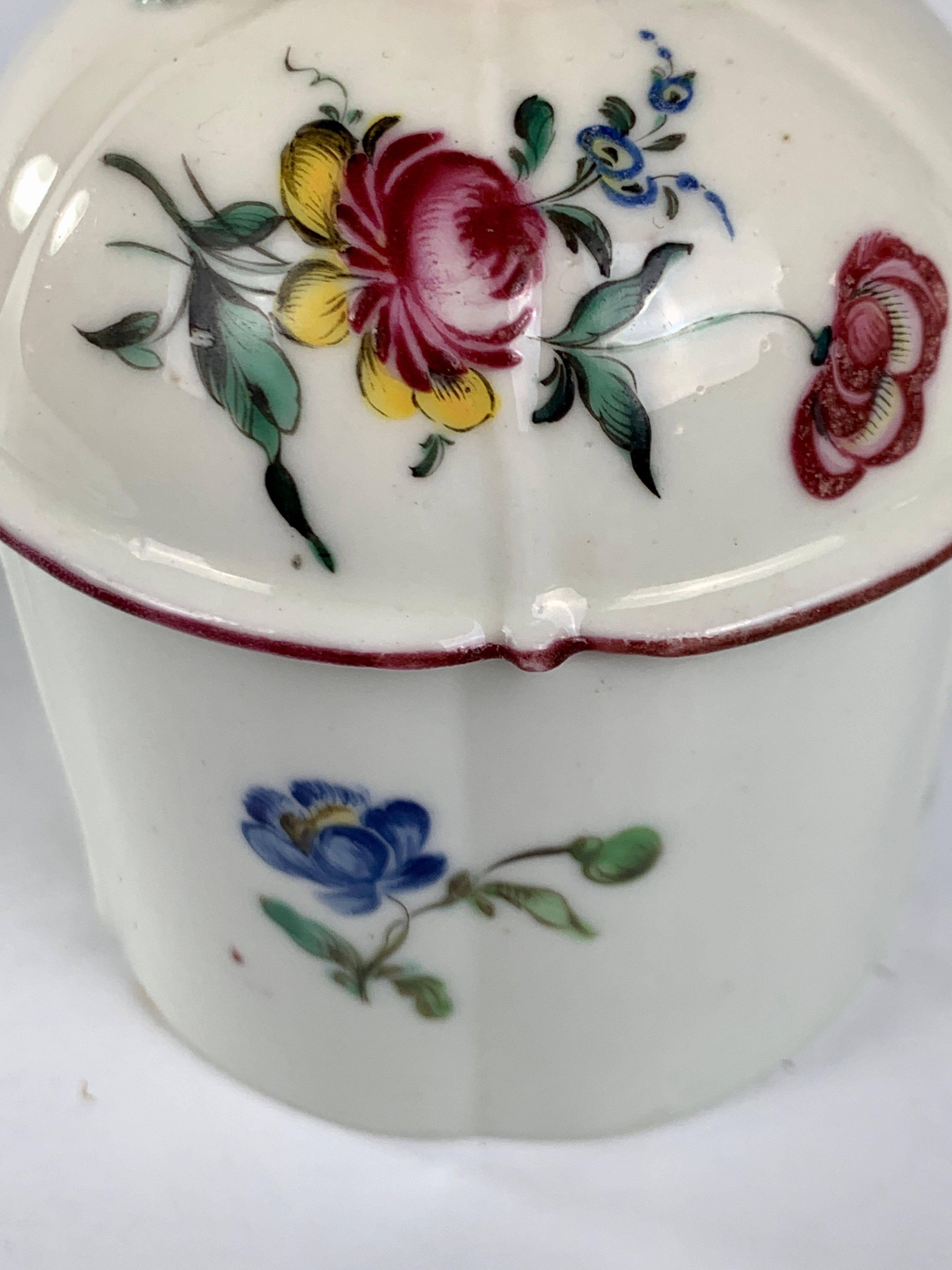 We are pleased to offer this beautiful Mennecy blush pot 'Pot à Fard' made circa 1750.
It is decorated with sprays of flowers, the finial shaped as a single purple rose with green leaves.
Marked 