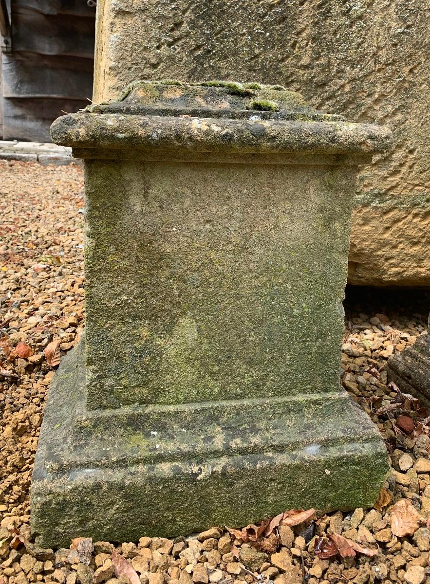 An early 18th century French sandstone pedestal. Subtle mouldings and attractive shape with beautiful patine and moss. One base corner missing, otherwise intact. Could be used to decirate the garden or as a pedestal for a sculpture or object.