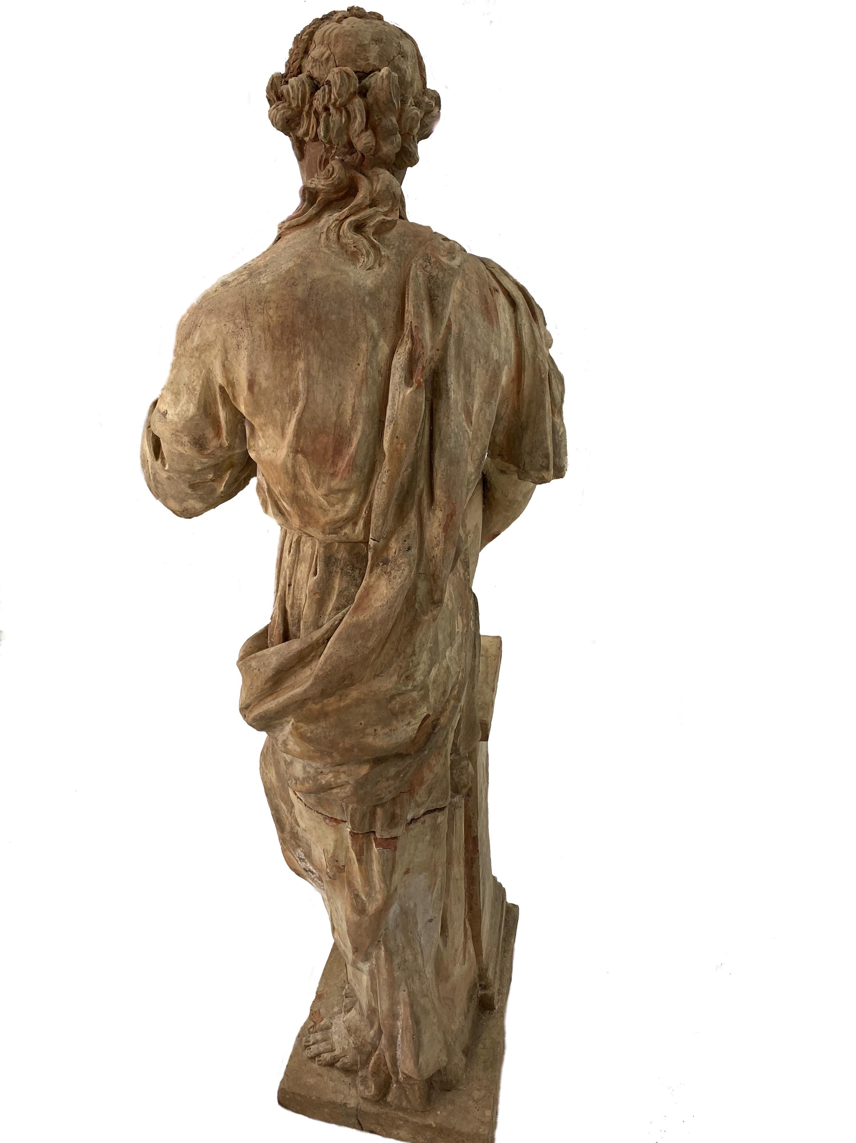 Gorgeous large 18th century French terracotta statue of a maiden. Hand chiseled and signed by artist.