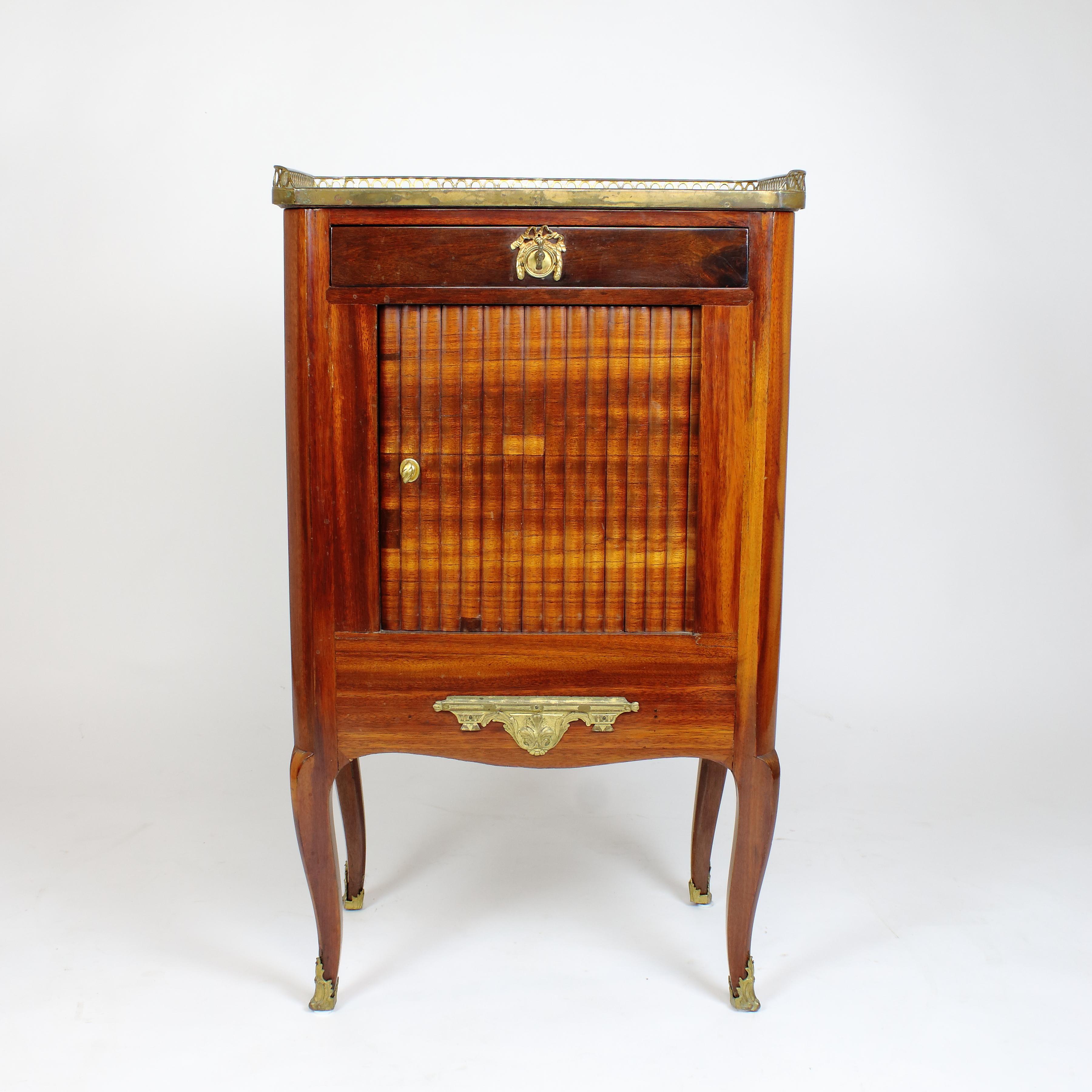 18th century French transition Louis XVI small writing cabinet Meuble Ecritoire

Rectangular cabinet with canted corners standing on four high cabriole legs with gilt bronze sabots; a sliding door underneath a frieze drawer revealing a removable
