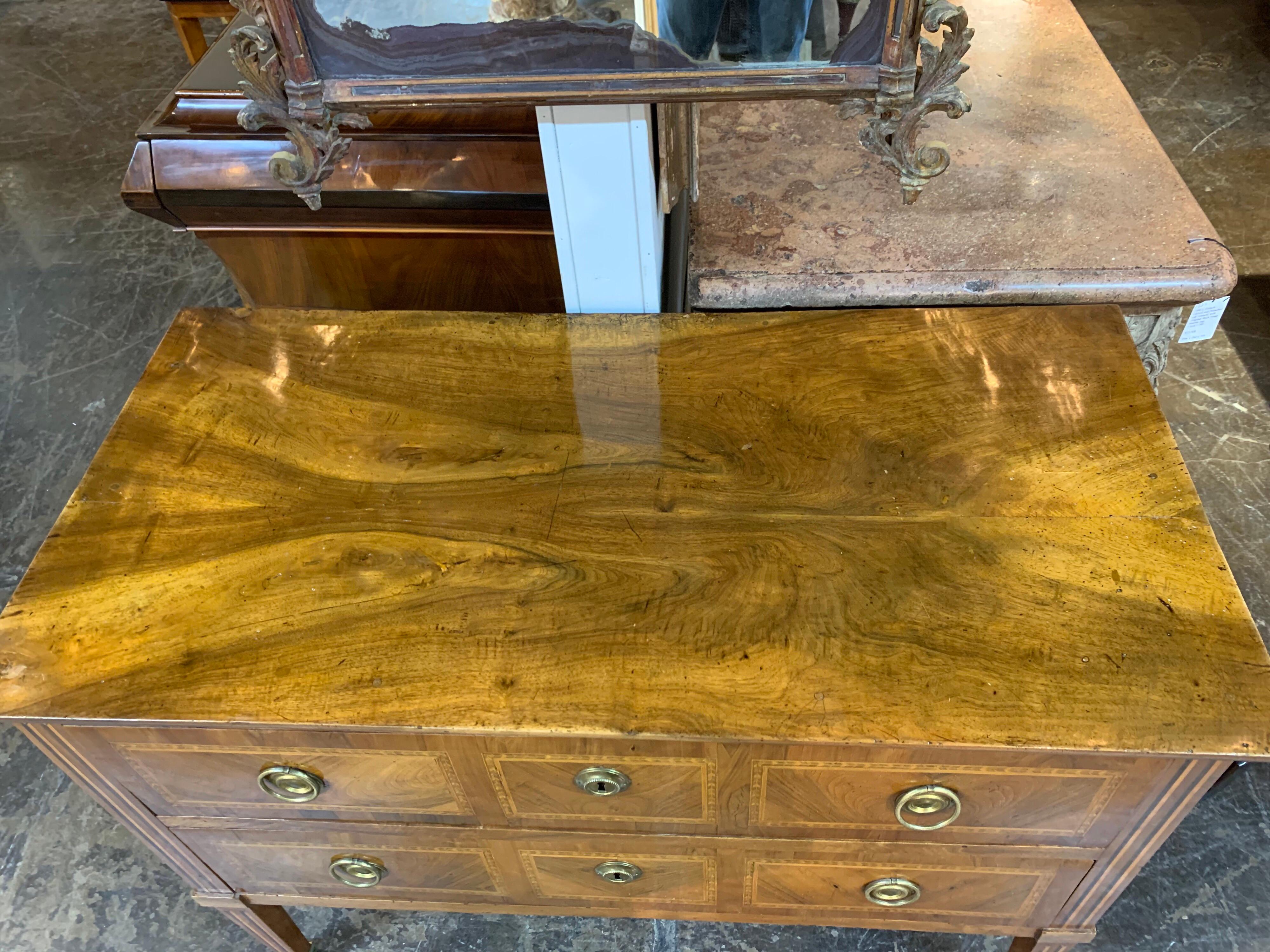 Fabulous 18th century French transitional chest with 2 drawers. The piece has nice inlaid details as well as a lovely finish on the top of the piece. A Classic beauty that would be a great addition to a fine home!