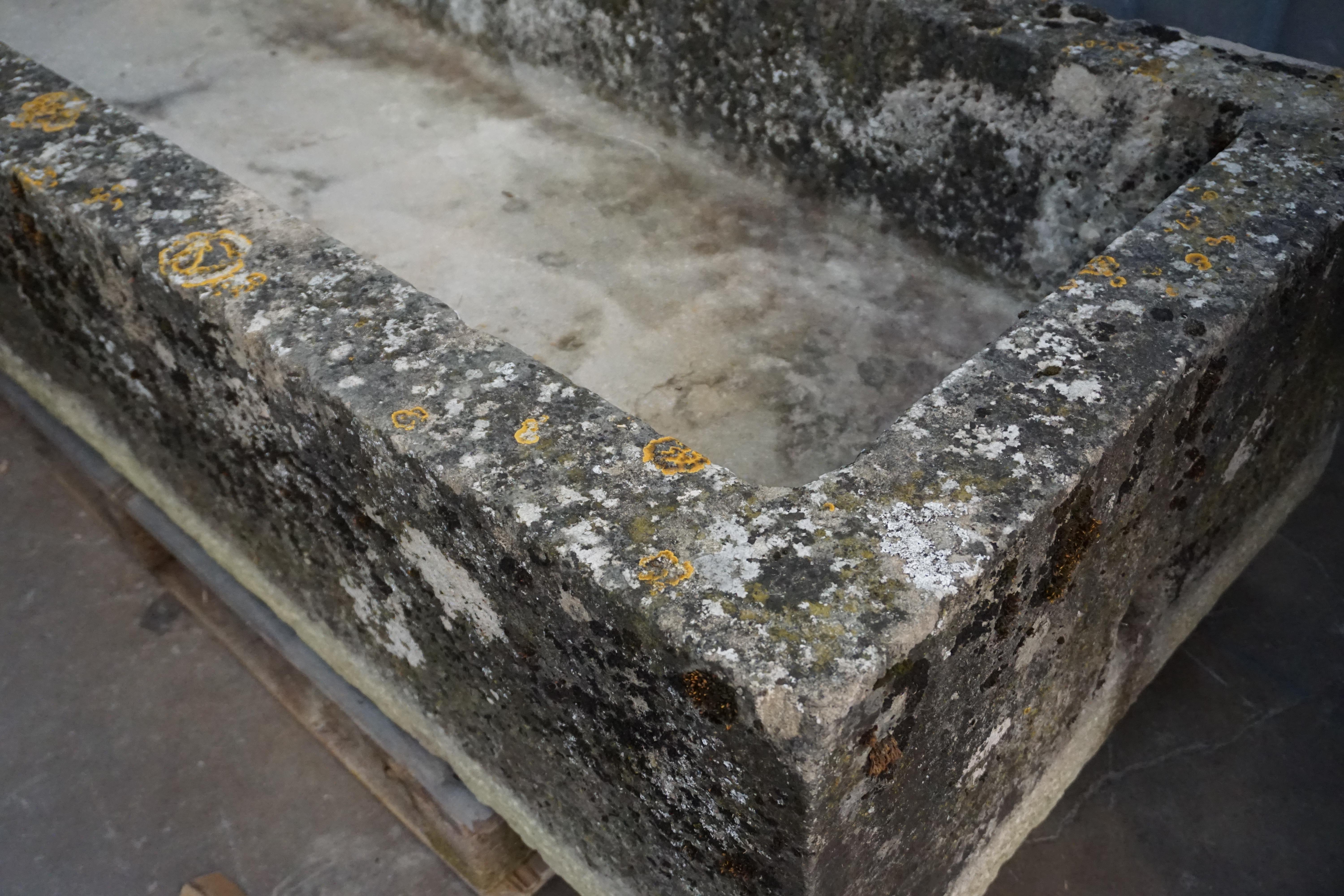 This trough originates from France, circa 1700. Made of limestone. Sturdy and suitable for an outdoor landscape.

Measurements: 29'' D x 69.5'' L x 15.5'' H.