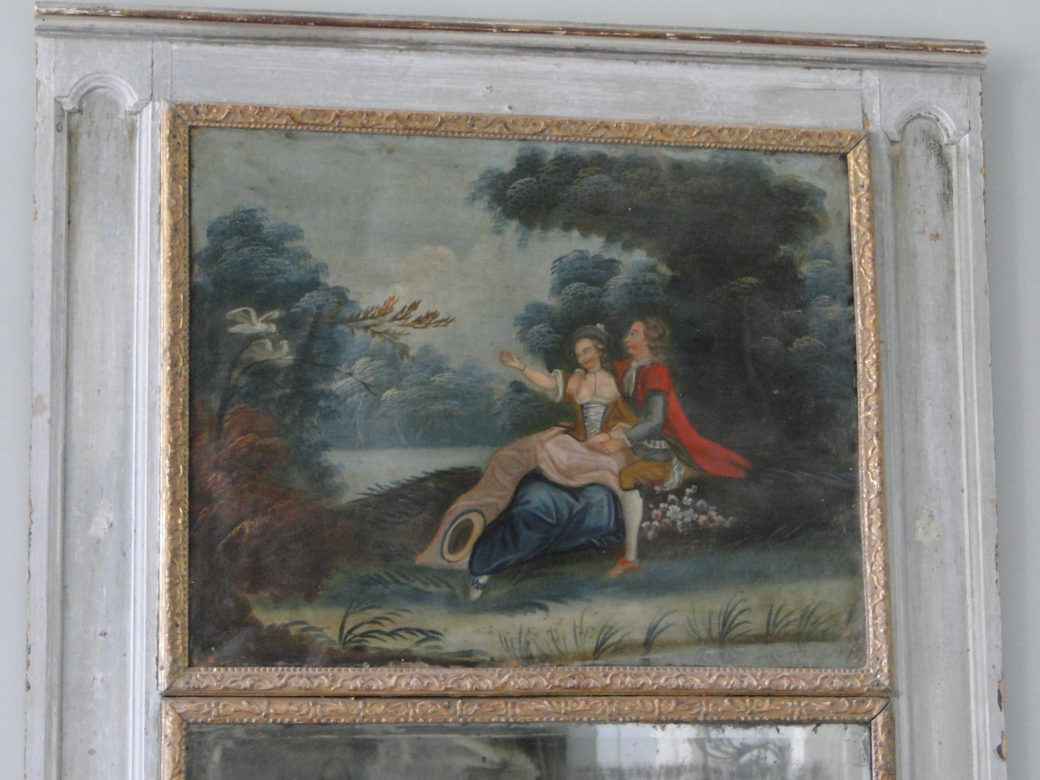 18th century Louis XVI trumeau, mirror retains the original glass and woodbacking as well as the romantic oil painted scene on canvas. The original crochets are visible on the back.