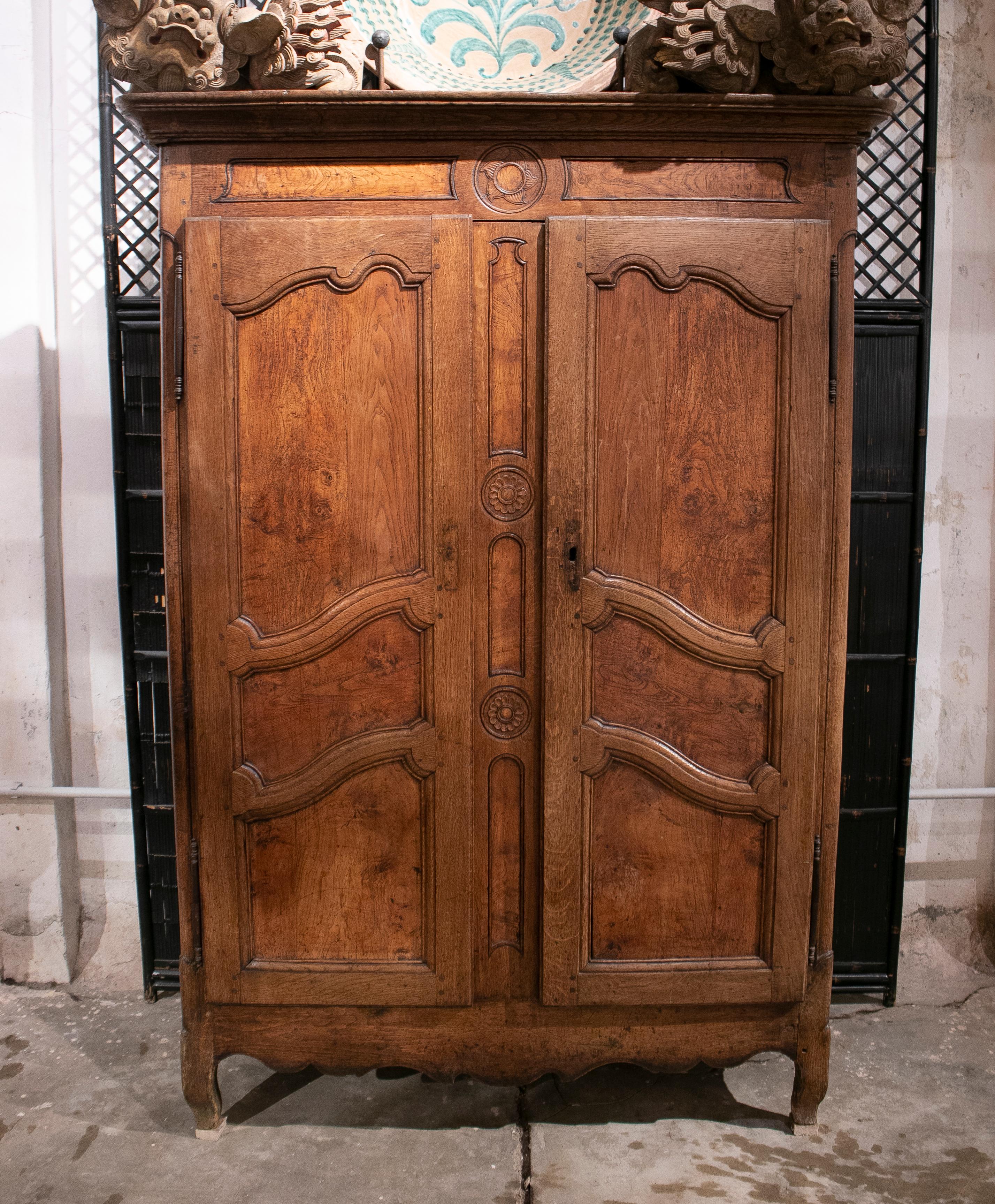 Antique 18th century French two door oak panelled wardrobe.