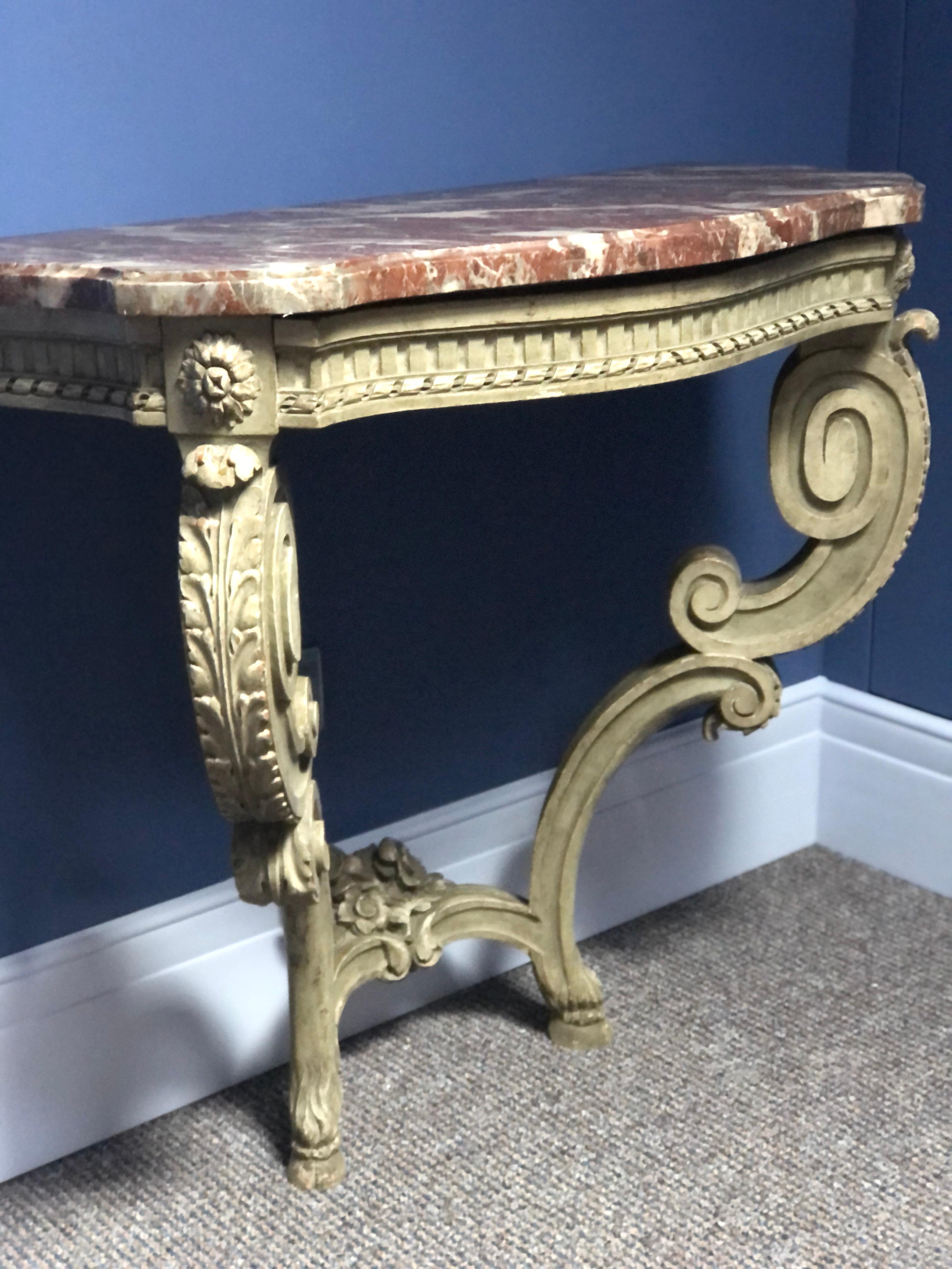 French wall console in gray lacquered wood and carved with acanthus leaves, two curved legs joined by a spacer decorated with a bouquet of flowers and with red marble top.
France, circa 1770
Measures: H 82.5, L 87.5, P 42.5 cm.