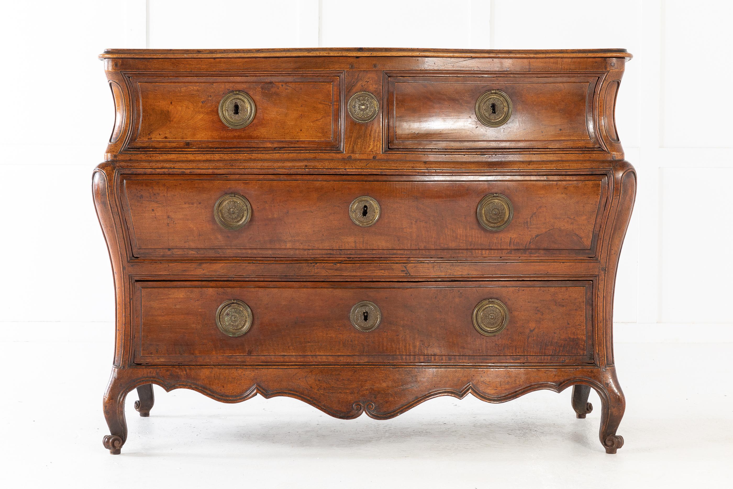 Good shape French 18th century walnut bombe commode with very nice color and original metal work.
  