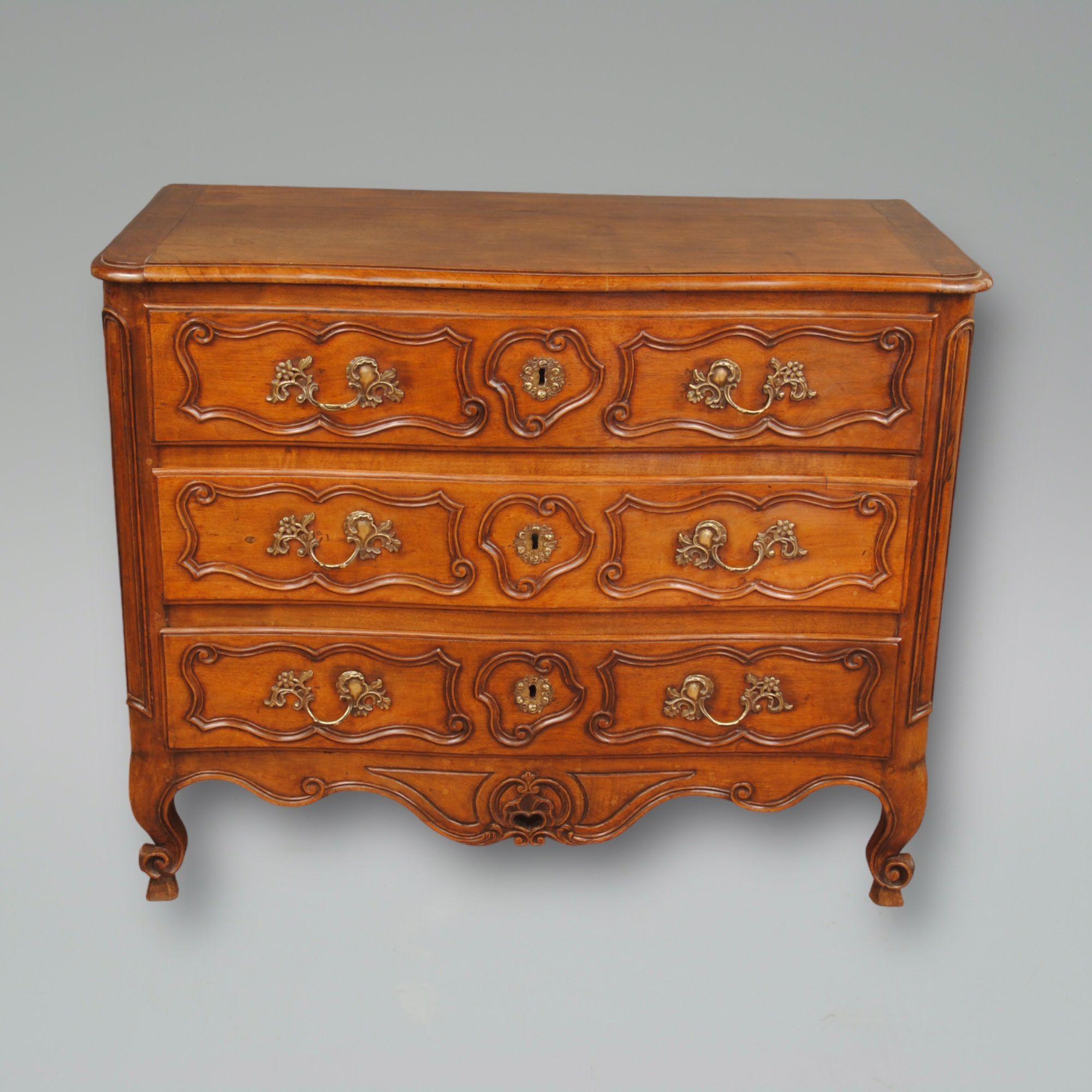 Carved 18th Century French Walnut Commode For Sale
