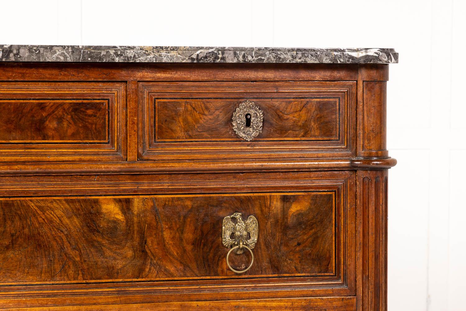 An exceptional quality, 18th Century French walnut commode with its original moulded grey and white veined marble top that conforms to the shape of the commode below. Having three small drawers across the top and a further two long drawers below,