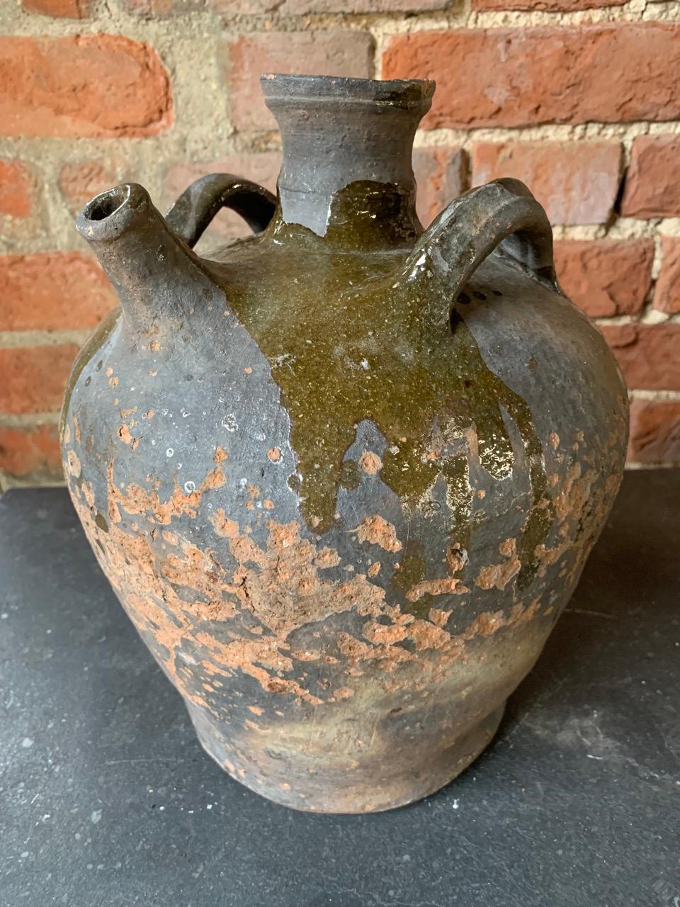 A nice 18th century French Walnut oil jug with a nice glaze.