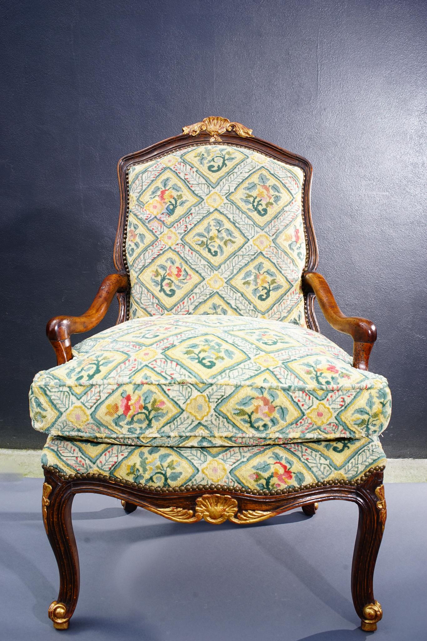 Hand-Carved 18th Century French Walnut Regence Armchair For Sale