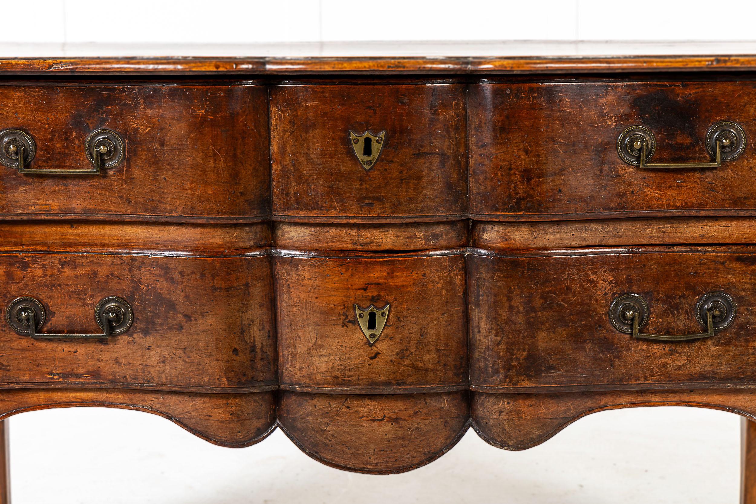 18th Century French walnut serpentine commode having two drawers standing shapely curved legs.
Great patination