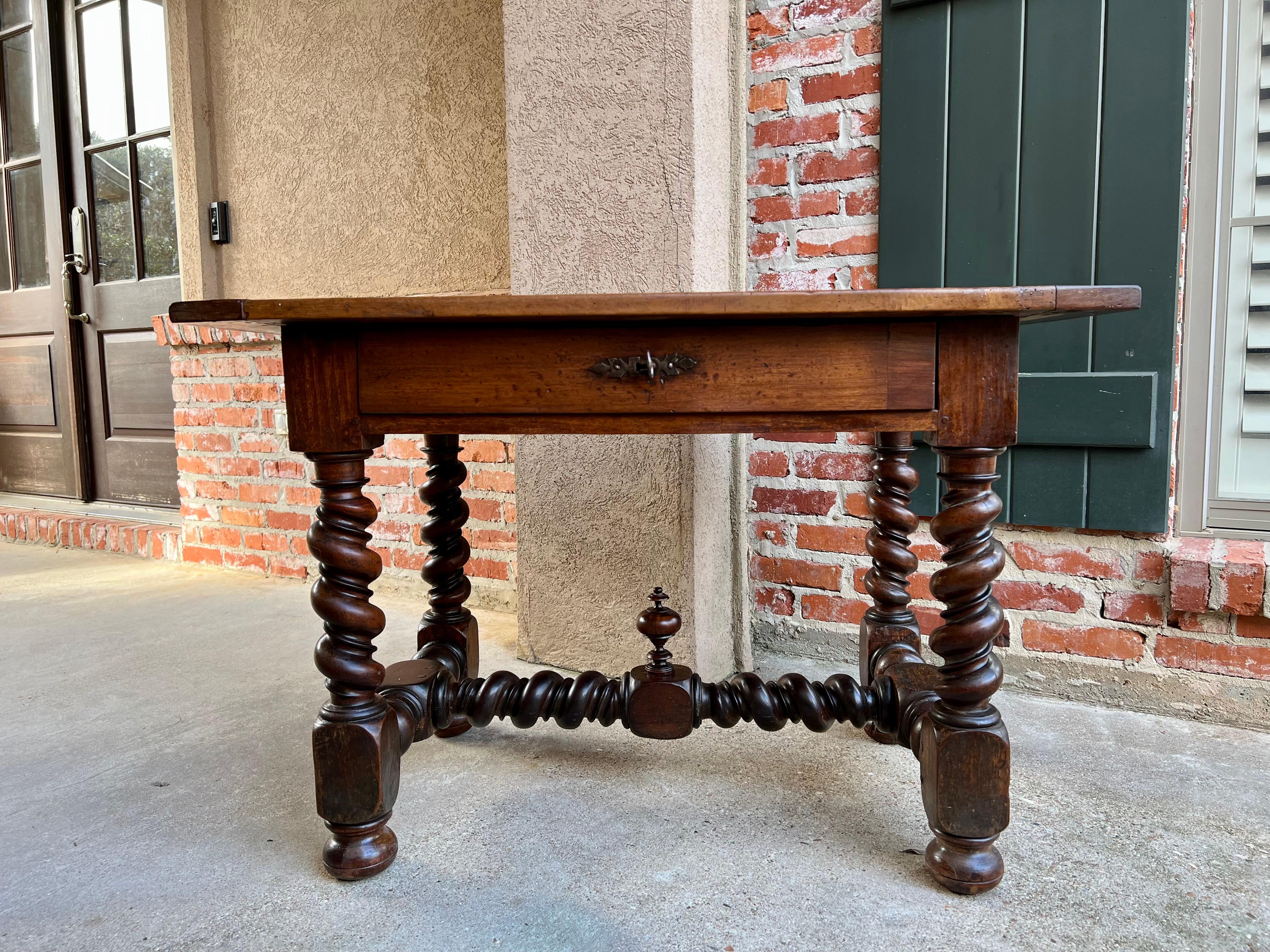 18th Century French Walnut Side Sofa Table Barley Twist Desk Louis XIII.

Direct from France, this incredible 18th century French center table or writing desk. Fabulous, thick, hand turned barley twist legs with large, pegged block joints. Superb