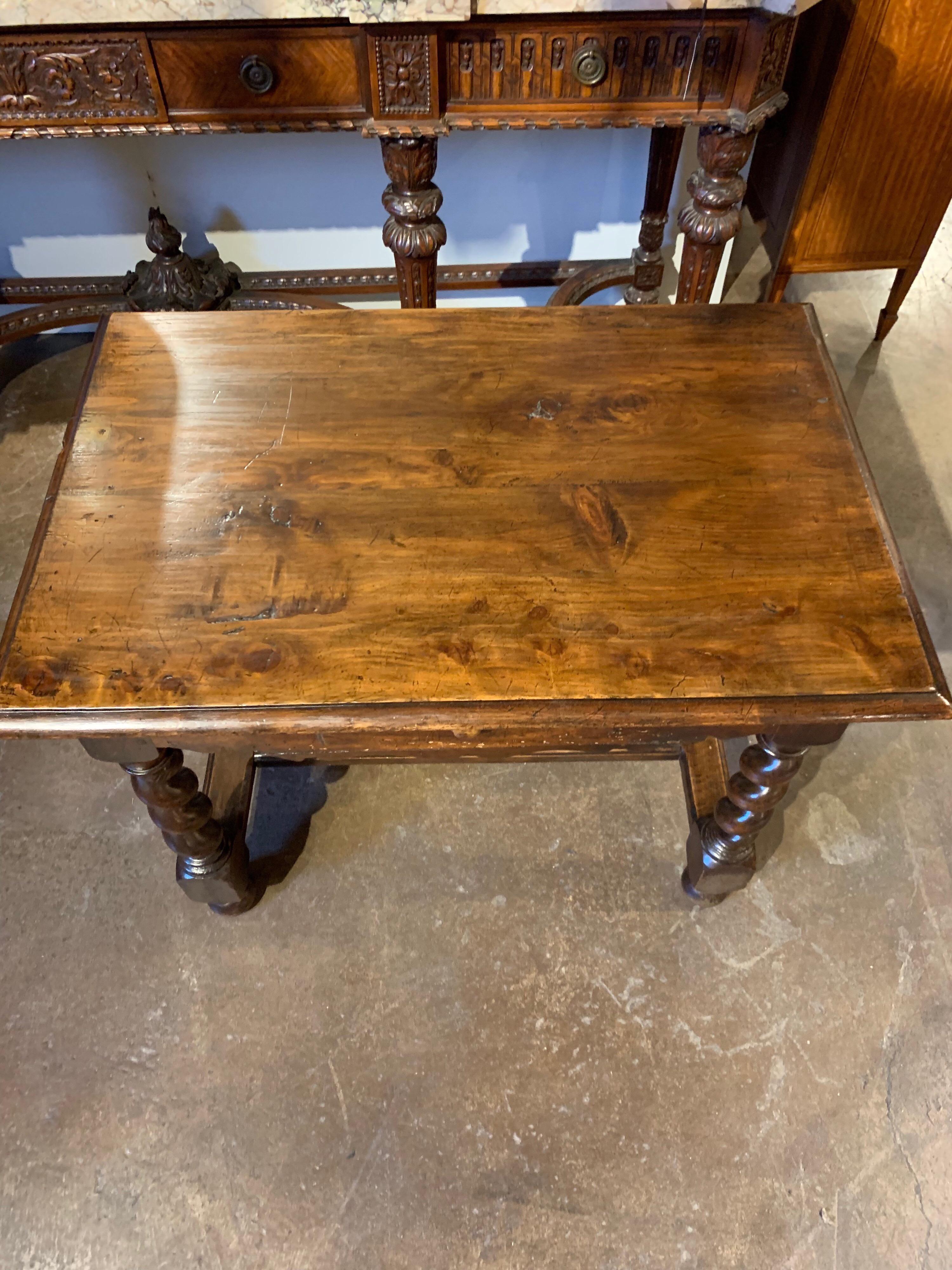 Very handsome antique French walnut table with barley twist legs. Note the peg construction and hand dovetailed drawer. A pure 18th century piece. In very nice condition with good old rich patina.
