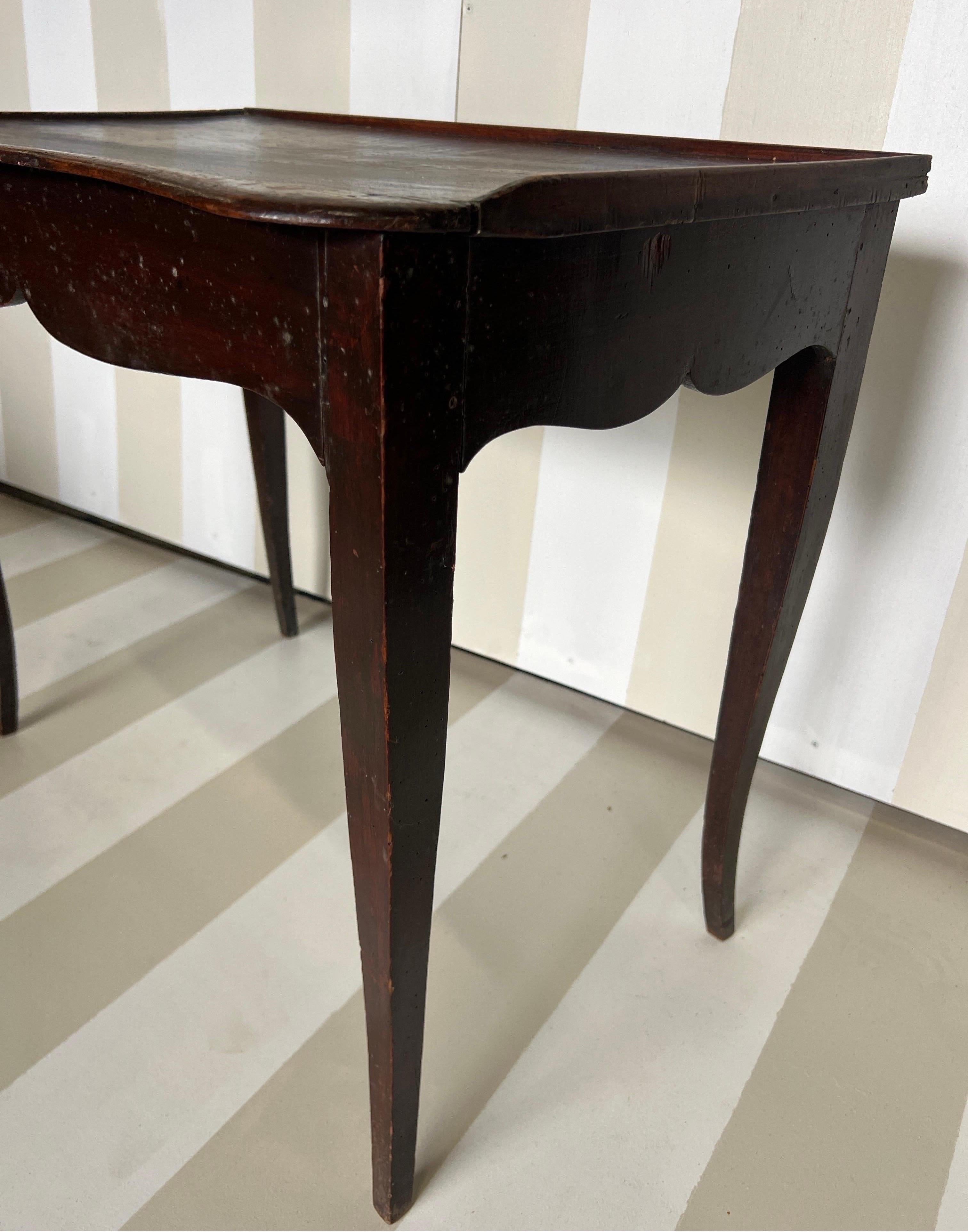 Pretty little 18th Century French Rococo side table with drawer and gallery. The drawer is on the left hand side and there is a gallery that covers the back and two sides of the top. 