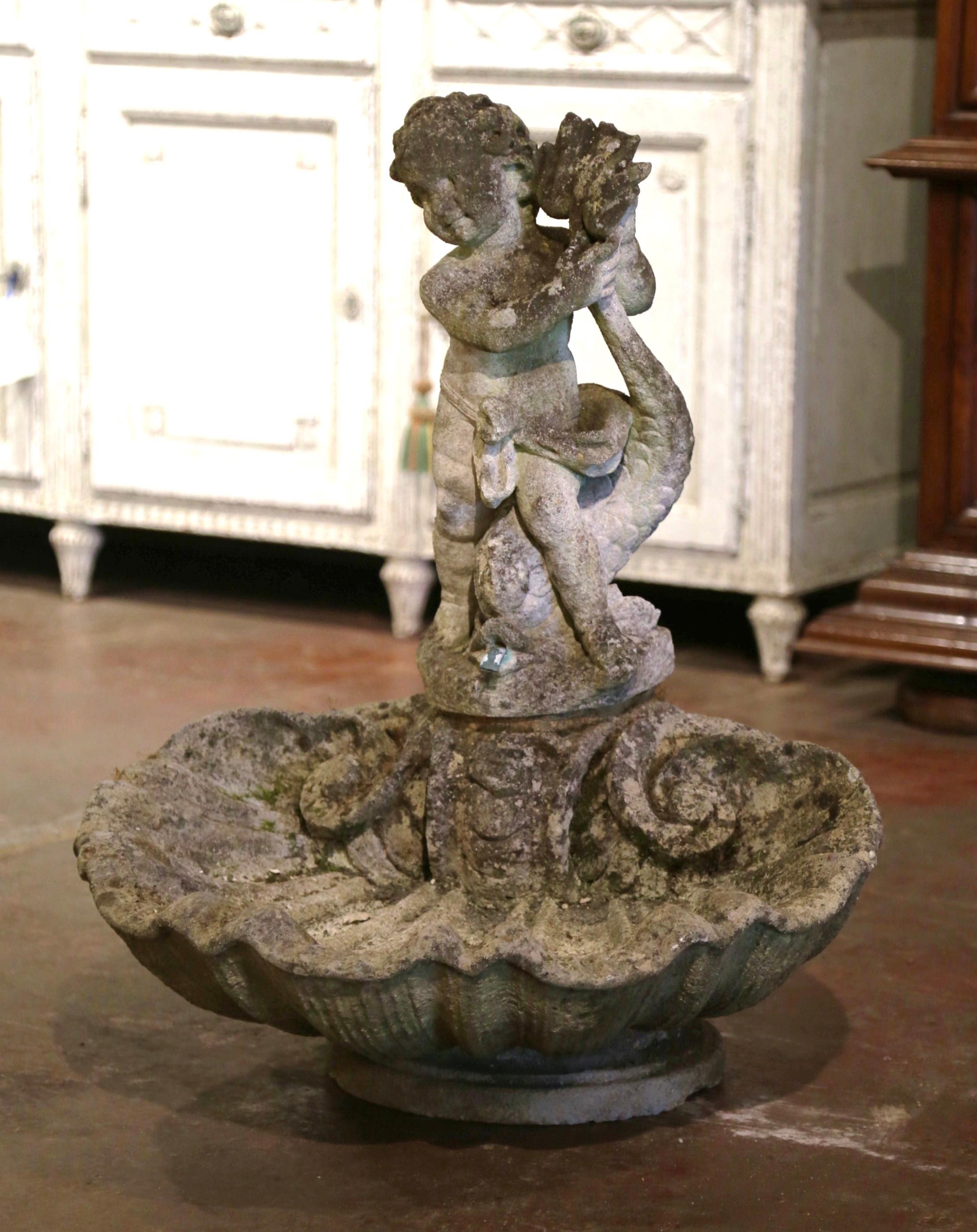 Decorate a garden or backyard with this elegant antique fountain birdbath. Crafted in France circa 1780 and coming from a Loire Valley chateau, the large garden element features a beautiful scalloped shell form basin at the base with a carved cherub