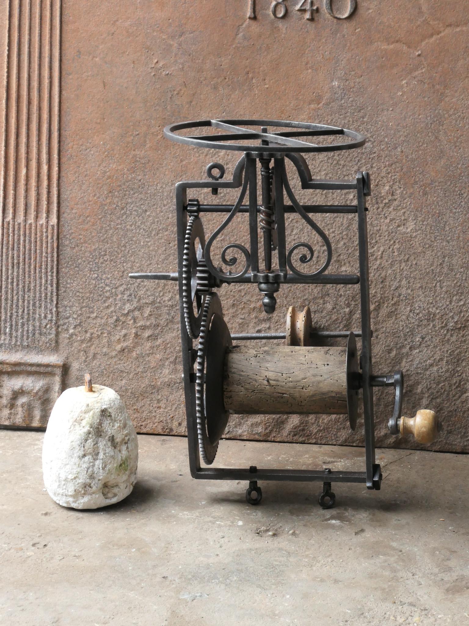 18th century French weight-driven roasting jack made of wrought iron, wood and its stone weight. It was used for cooking in a kitchen fireplace. The mechanism is still functional, though it misses the rope and a pulley at the left side.






 