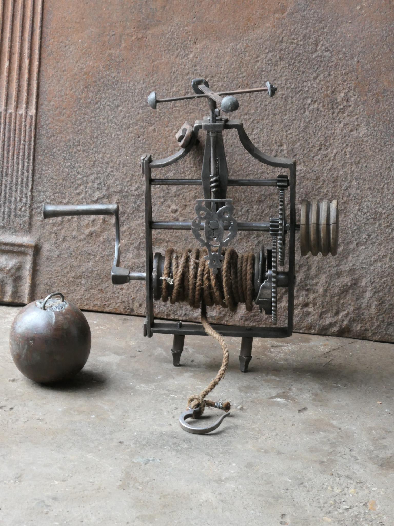18th century French weight-driven roasting jack made of wrought iron, wood, rope and its leaden weight. It was used for cooking in a kitchen fireplace. The mechanism is still functional.






 