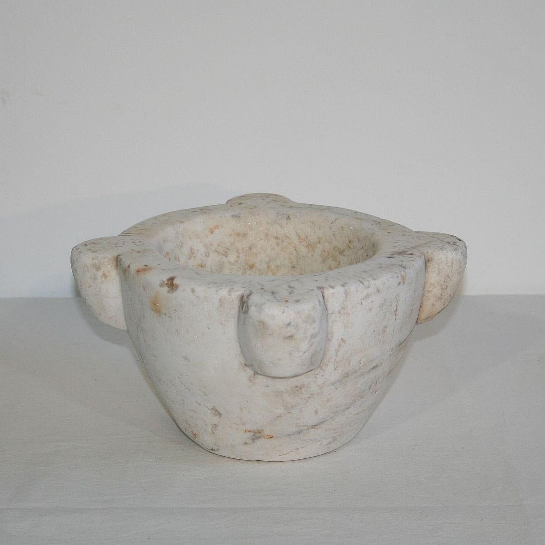 Primitive French white marble mortar, France, 18th century. Weathered.