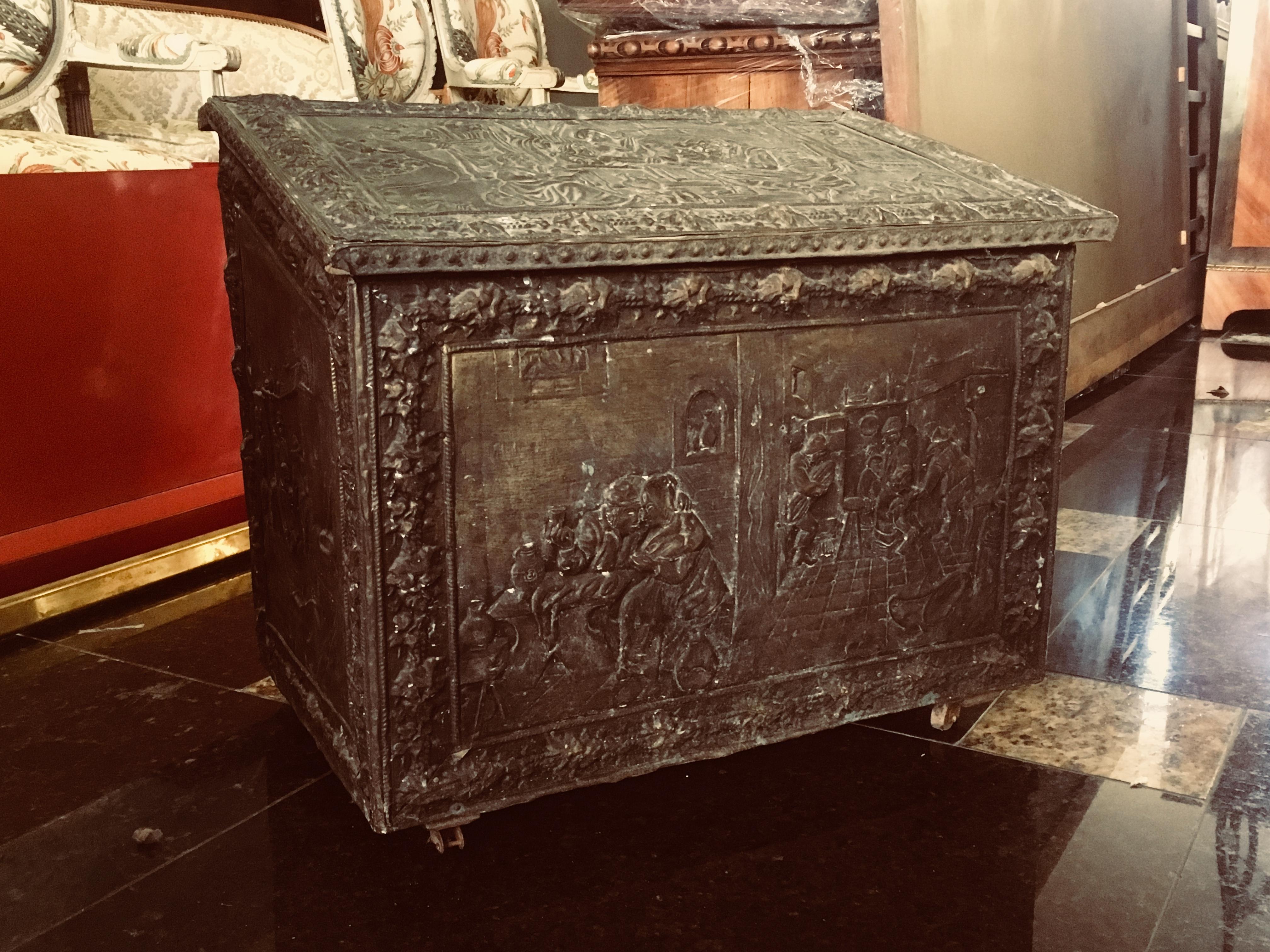 This is an 18th century French wooden coffer or trunk or blanket chest, with rich wrought iron decoration from all the sides and has a great patina too. 
France, circa 1770.