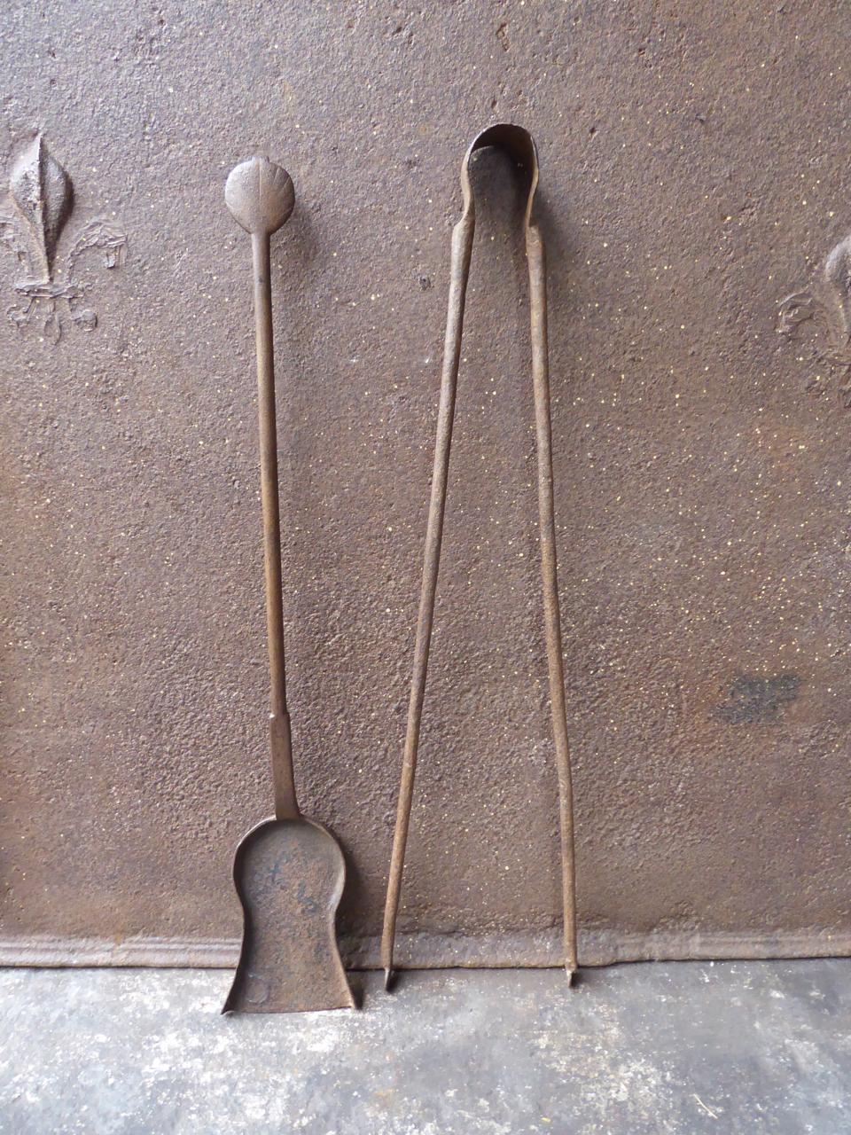 18th century French Louis XV fireplace tool set. The fire irons are made of wrought iron. They are in a good condition and fully functional.
