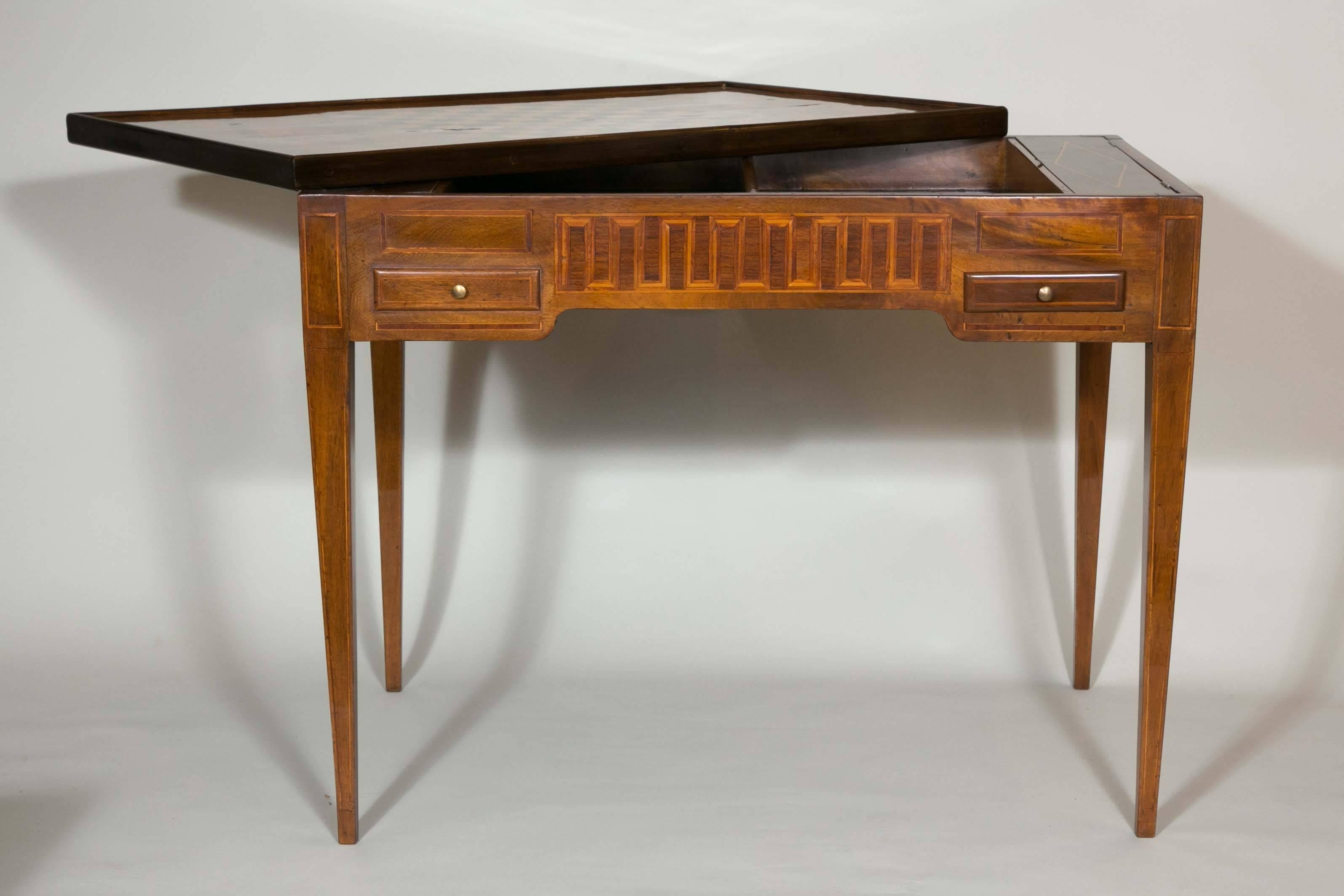18th century games table in marquetry of precious and rare woods, Louis XVI period, Luxury interior design.
 