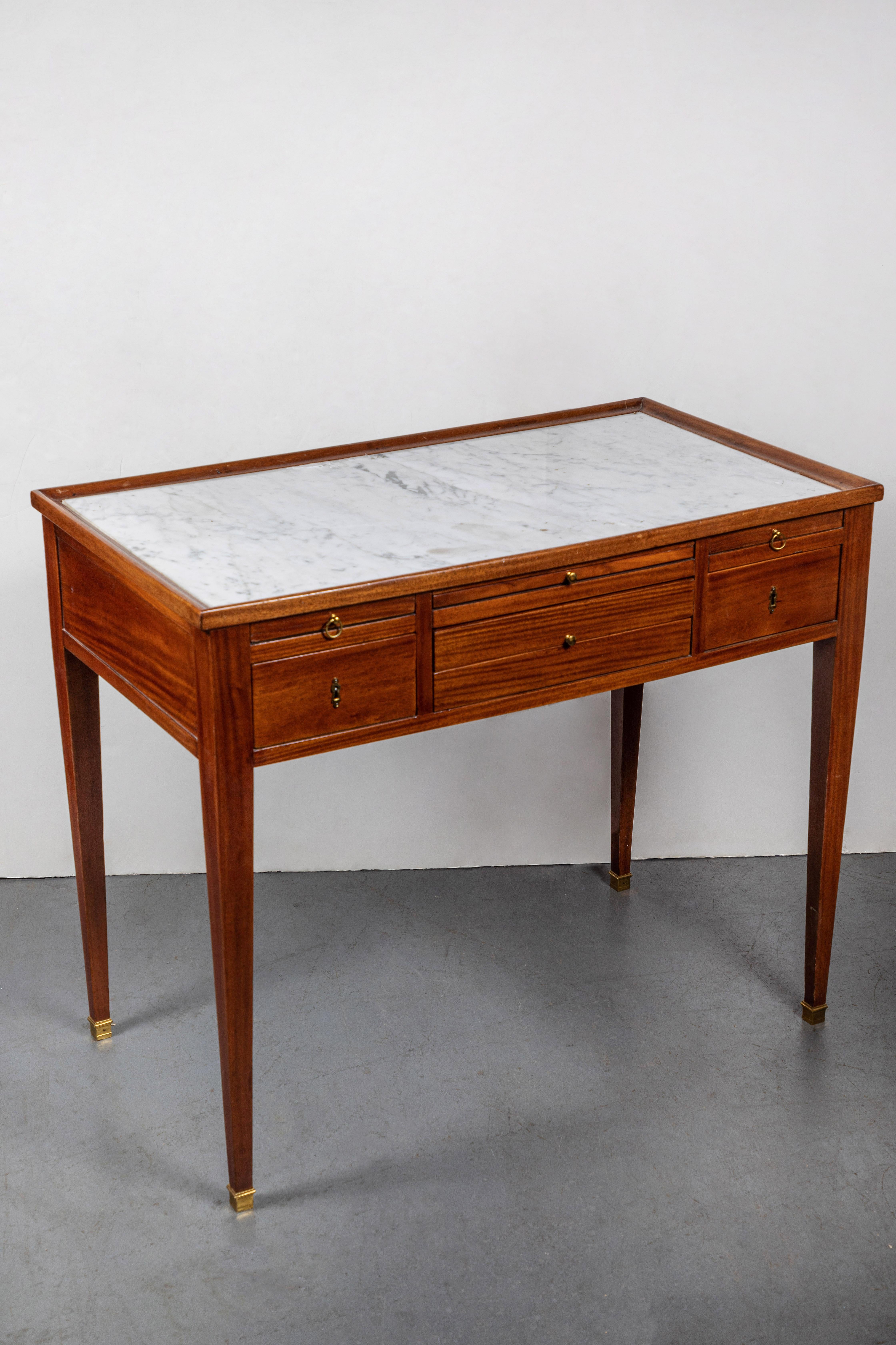 Wonderful, circa 1780, hand carved, petite writing desk inset with game chess and backgammon game boards. The top featuring its original, inset marble. The whole on tapered legs terminating in ormolu feet.
