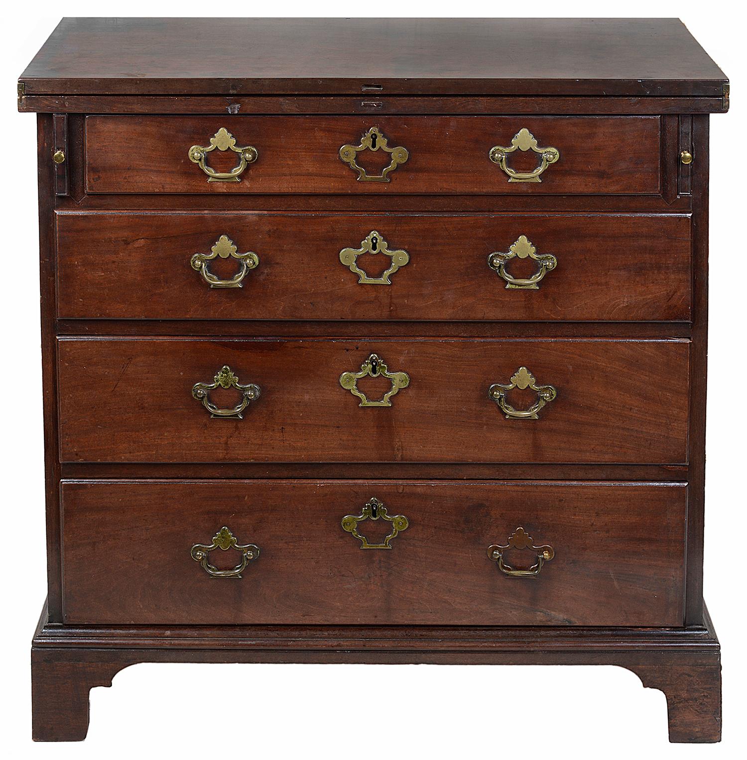 A rare and very good quality 18th century George 11 red walnut bachelors chest. Having a hinged solid walnut top, supported on loppers that pull out with brass button knobs, each of the oak lined graduating drawers have the original pierced brass