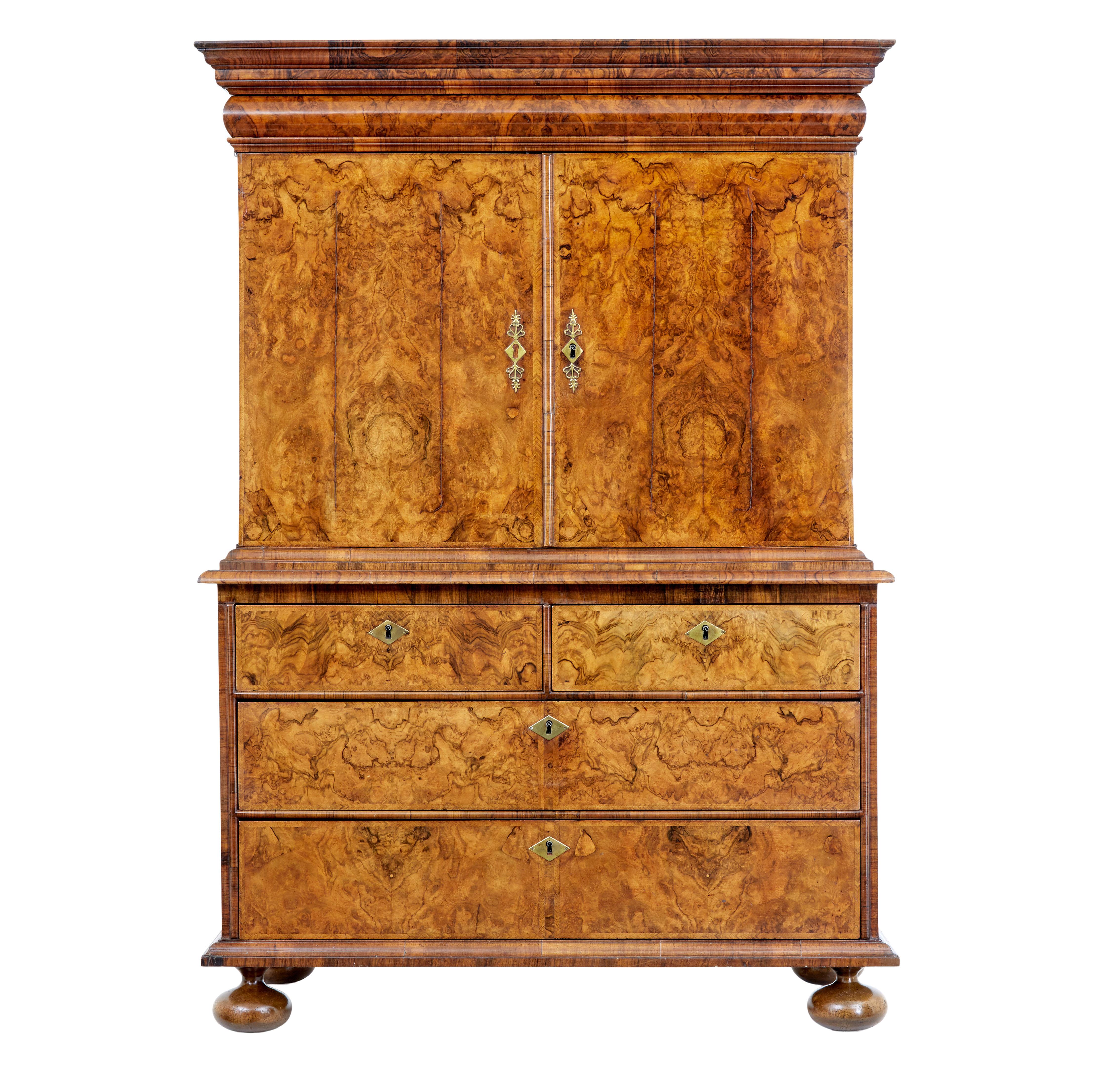 18th century George I walnut cabinet on chest, circa 1710.

We are pleased to offer this stunning cabinet in the manner of coxed and woster.

The piece is lavishly veneered in burr walnut, with a burr elm interior which was coloured the same as