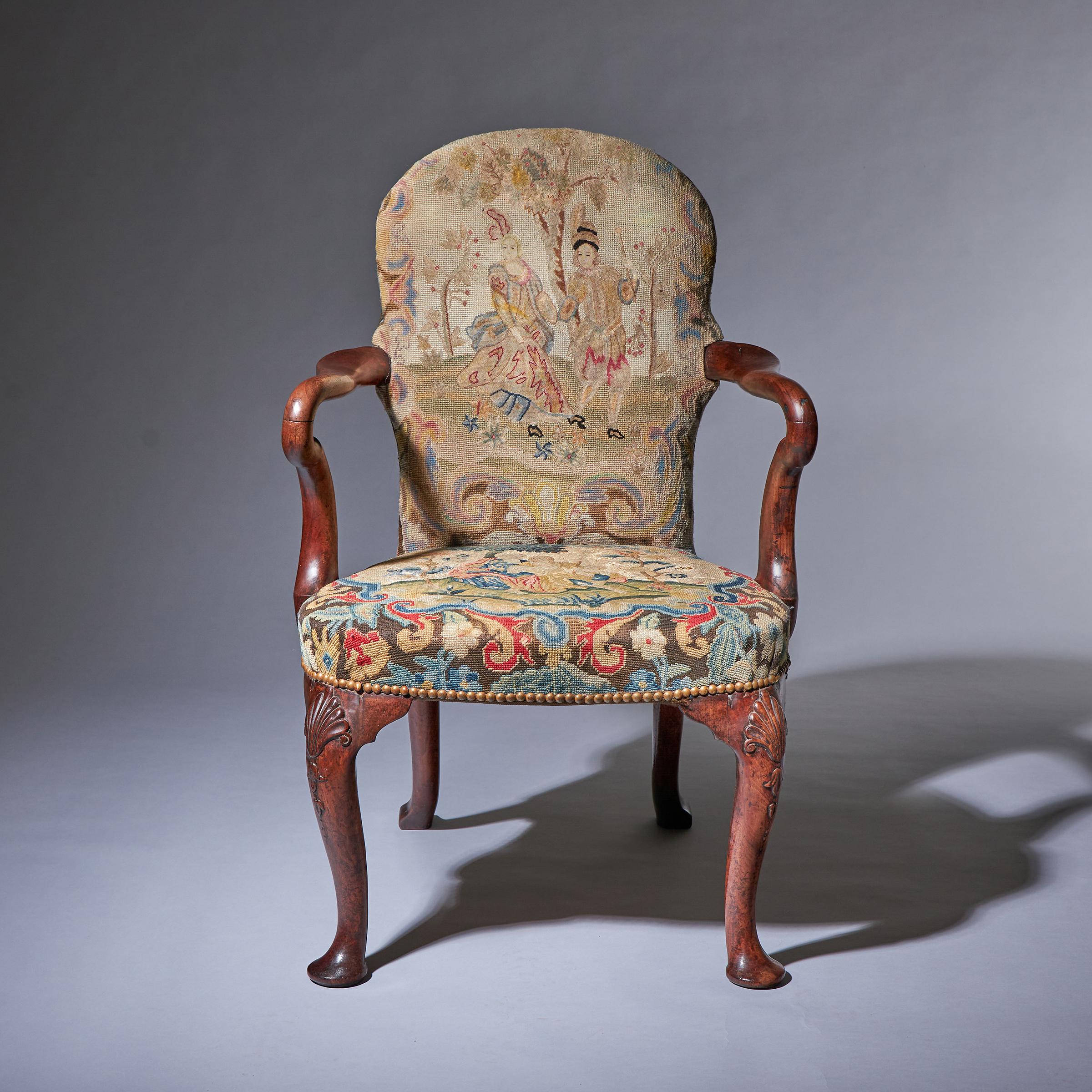 A wonderfully drawn early 18th century George I walnut shepherd's crook armchair covered in period needlework, circa 1730. England.

A simply exquisite example of an early 18th-century shepherd's crook armchair dating from the reign of George