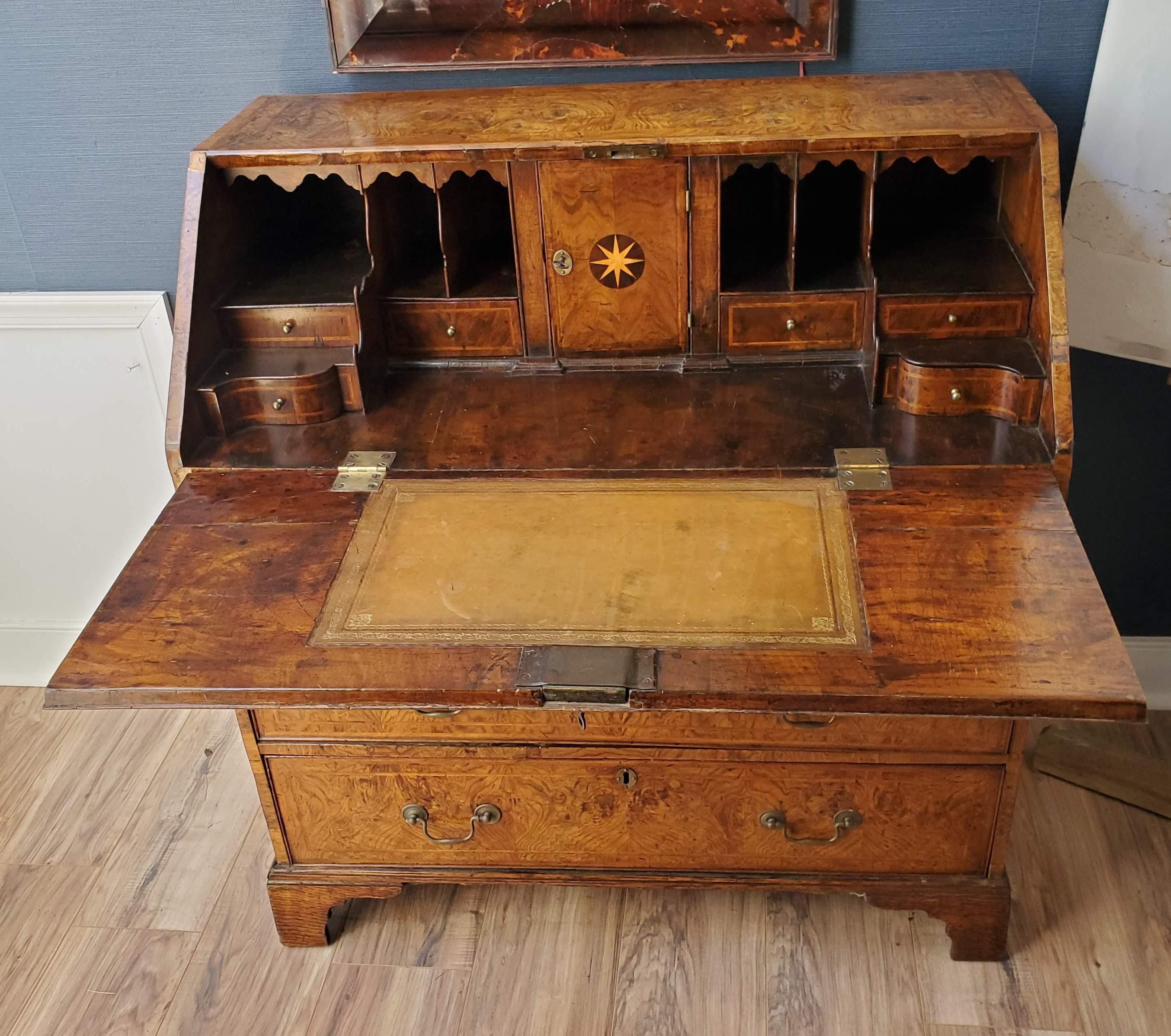 Extraordinary 18th Century George II Period Slant Top desk. Made predominately of highly figured Burled Ash with the original deep patination and rich lustrous color. Veneer is “Book Matched” throughout with intricate “feather banding”. Three small