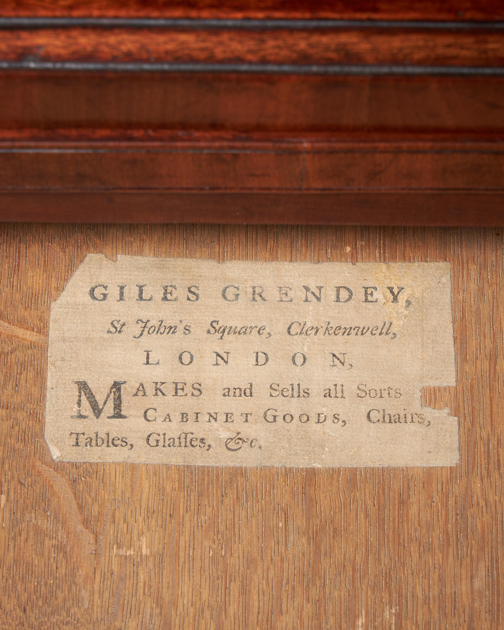 An important George II mahogany caddy-topped chest, circa 1730-1740 labelled, Giles Grendey.

The ‘caddy’ moulded top sits above a brushing slide over four long graduating drawers, each cock-beaded and bearing their original open fret handles and