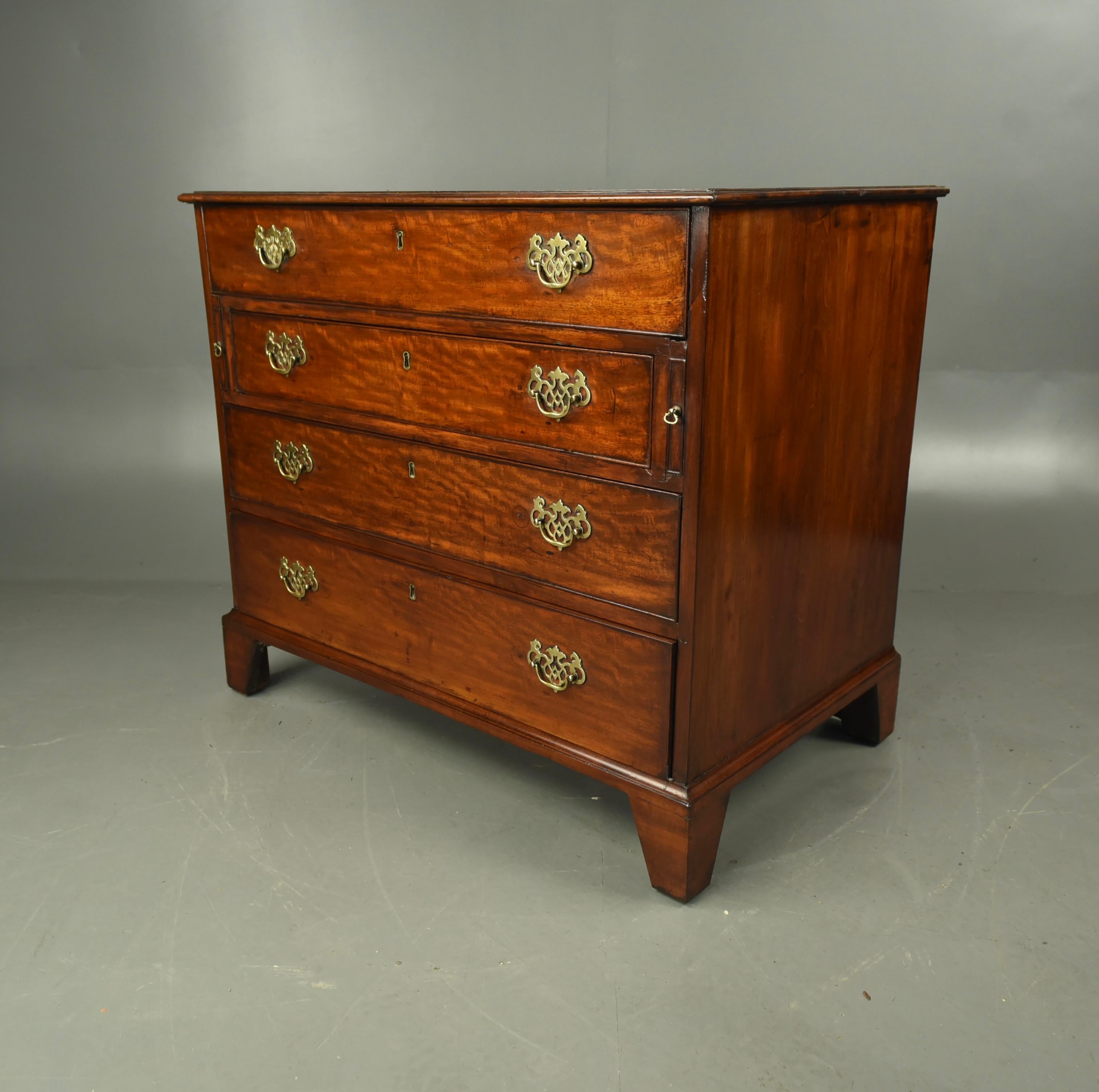 Fine quality George II mahogany Gentleman's dressing chest circa 1750 .
The chest has a fully fitted top drawer with a sliding writing surface ,beneath this it is fully fitted with trinket and stationary compartments with a central original lift up