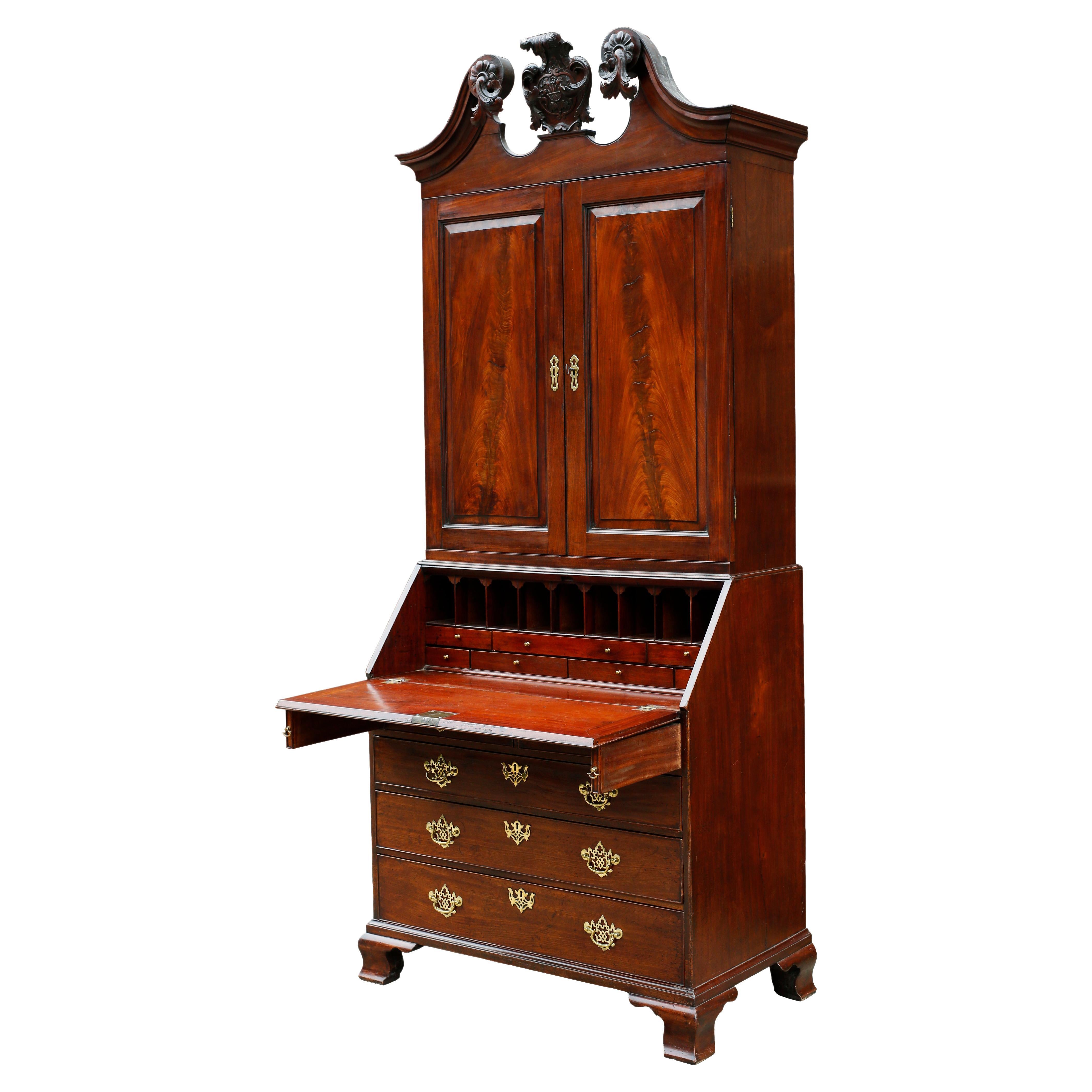 A magnificent English 18th century Chippendale secretary bookcase of exceptional detail. The composition is marked by a robustness and architectural quality that is complemented by its superb timber.

The top of the piece is crowned by a swan