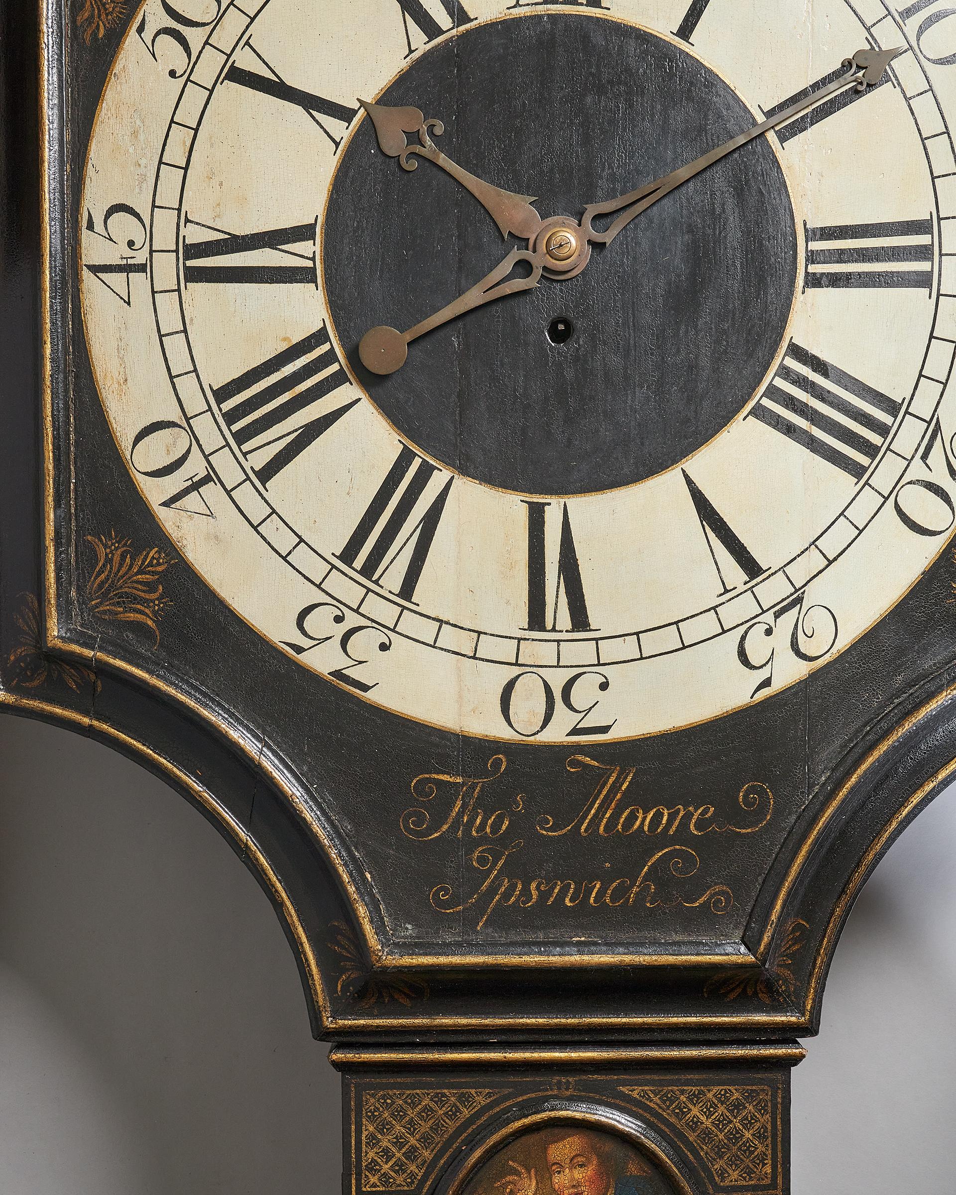 Tavern clock by Thomas Moore Ipswich

A fine eighteenth-century tavern clock with a japanned shield dial and gilt decorations, signed at the bottom of the dial in gilt letters Thos Moore Ipswich, c. 1740. 

The black japanned case of traditional