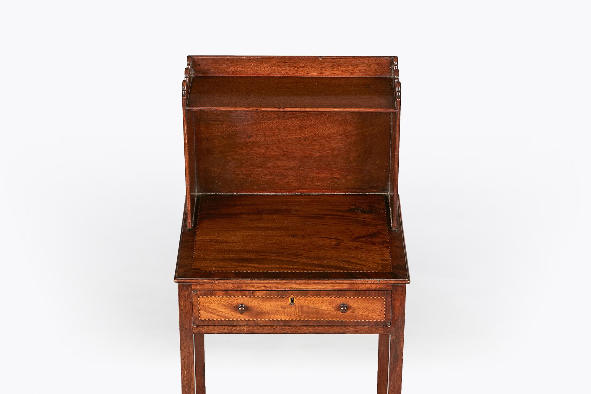 18th century George III mahogany book/side table, the moulded shaped top above single shelf raised over single line inlaid drawer supported over Marlborough leg joined by shaped concave stretcher.