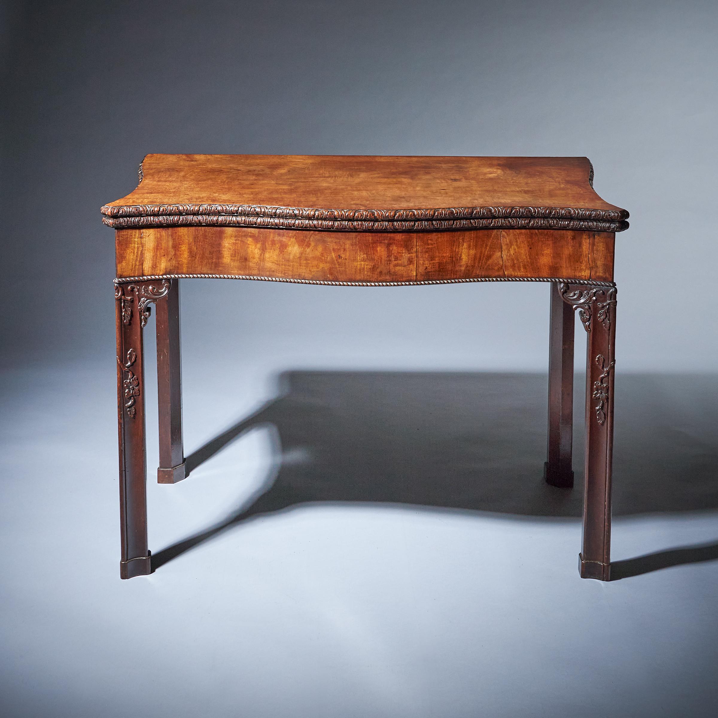 A bold and impressive George III carved mahogany serpentine concertina action card table, circa 1760. 

In the manner of William Vile & John Cobb, St Martin's Lane, London

William Vile was one of the foremost cabinetmakers of mid-18th century
