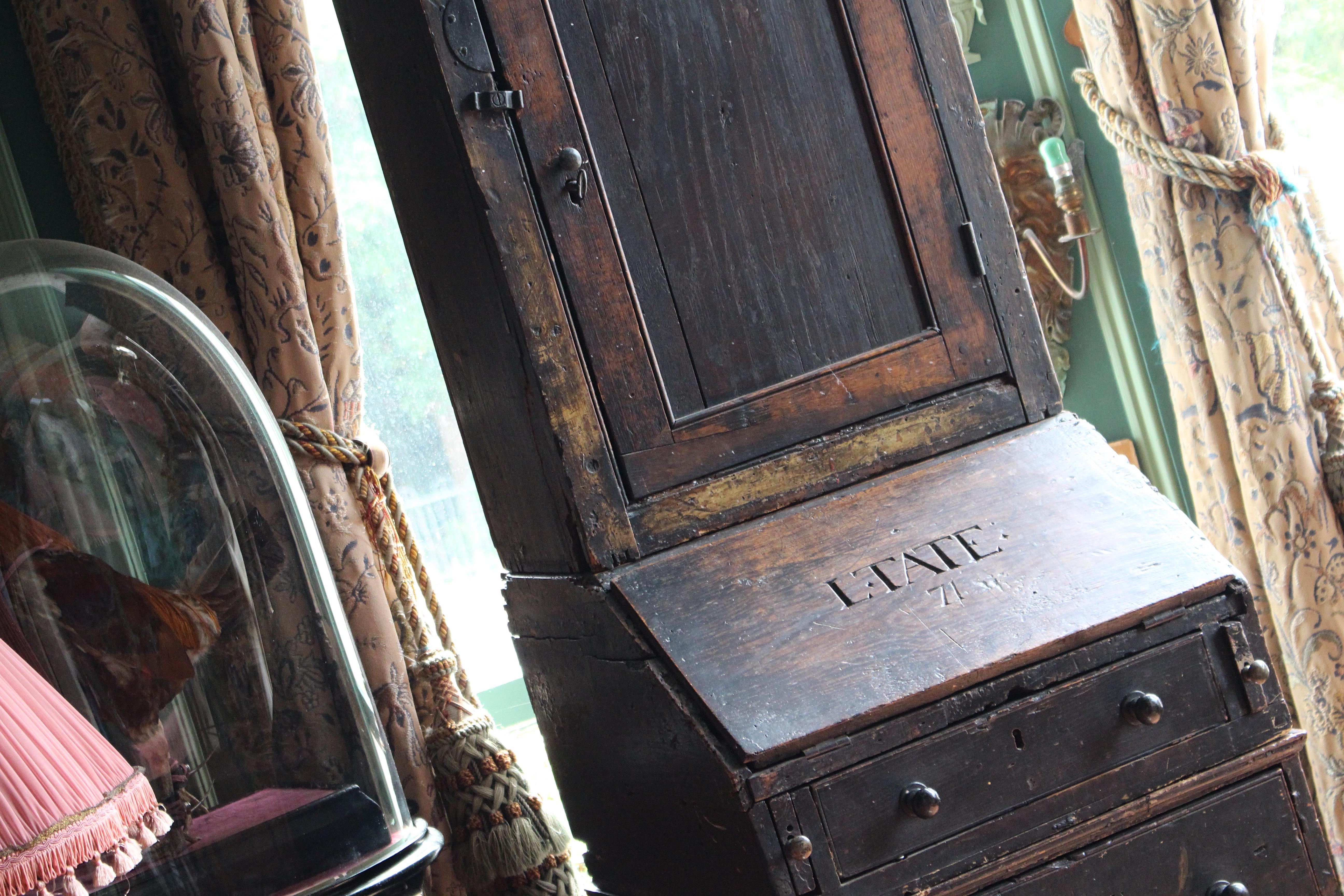 A rare George III bureau bookcase from a dormitory of Winchester College circa 1770 

Heavily inscribed with the names of pupils and dates. The front of the fall is inscribed 