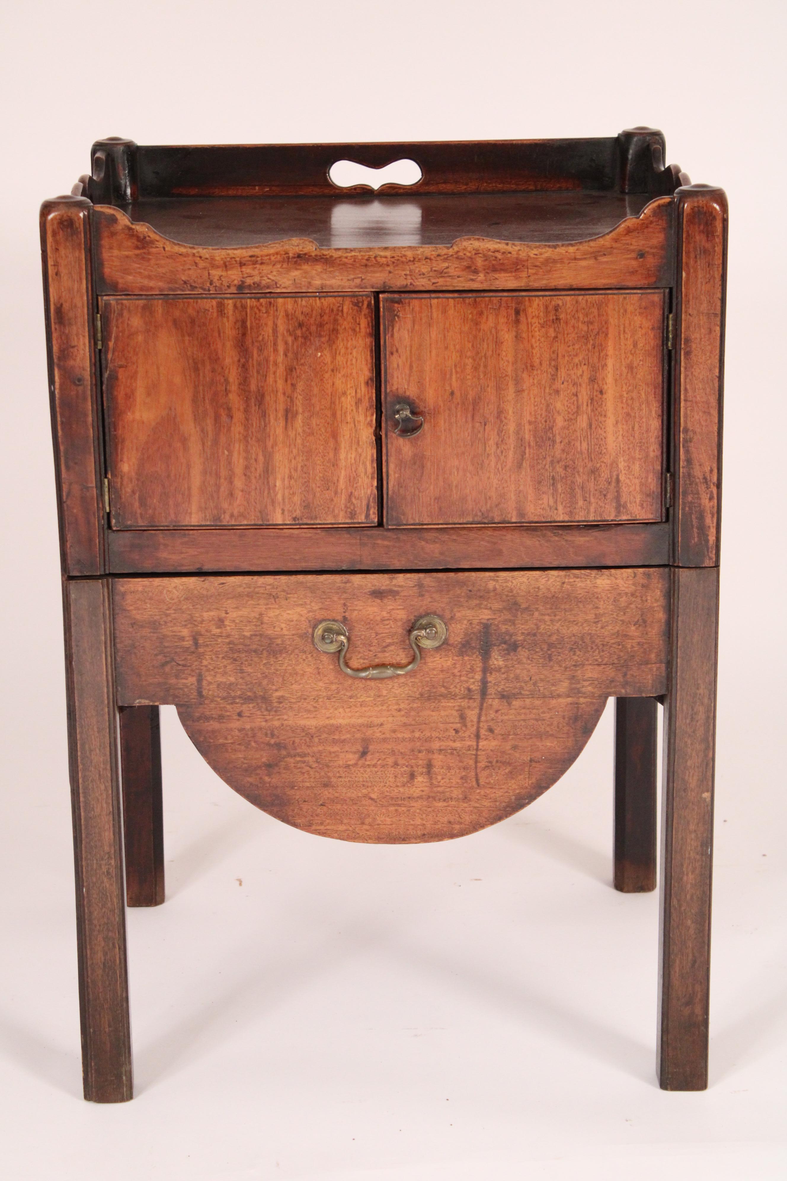 George III Mahogany bedside commode, circa late 18th century. The front and sides with  a double serpentine gallery below are two doors the bottom apron pulls out, see photos.  Ideal table for a living room next to a sofa or next to a bed. Nice old