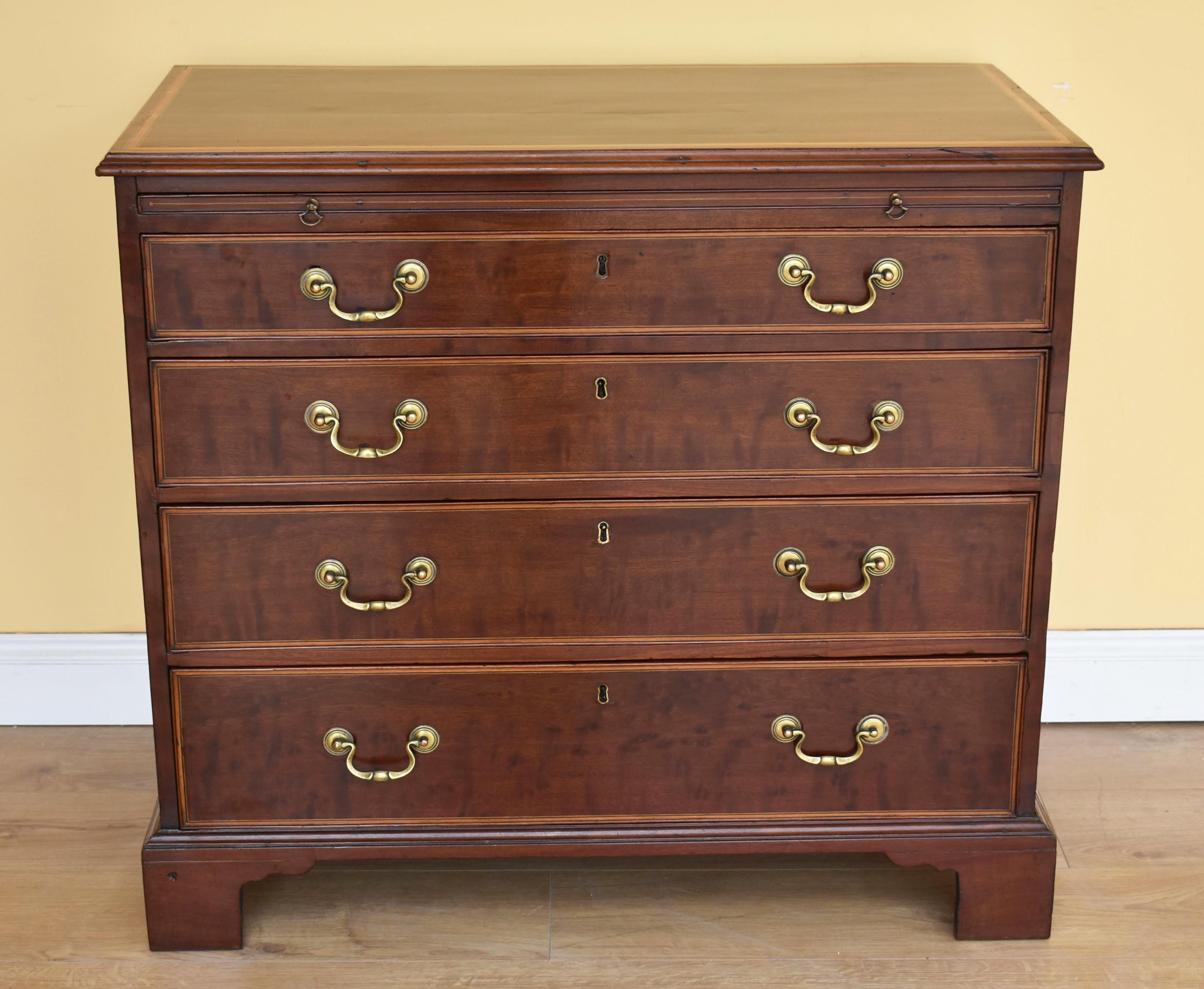 For sale is a good quality George III mahogany and later inlaid chest of drawers. The top of the chest has an inlaid edge above four graduated drawers, each with matching inlays and brass swan handles. Standing on bracket feet, this chest of drawers
