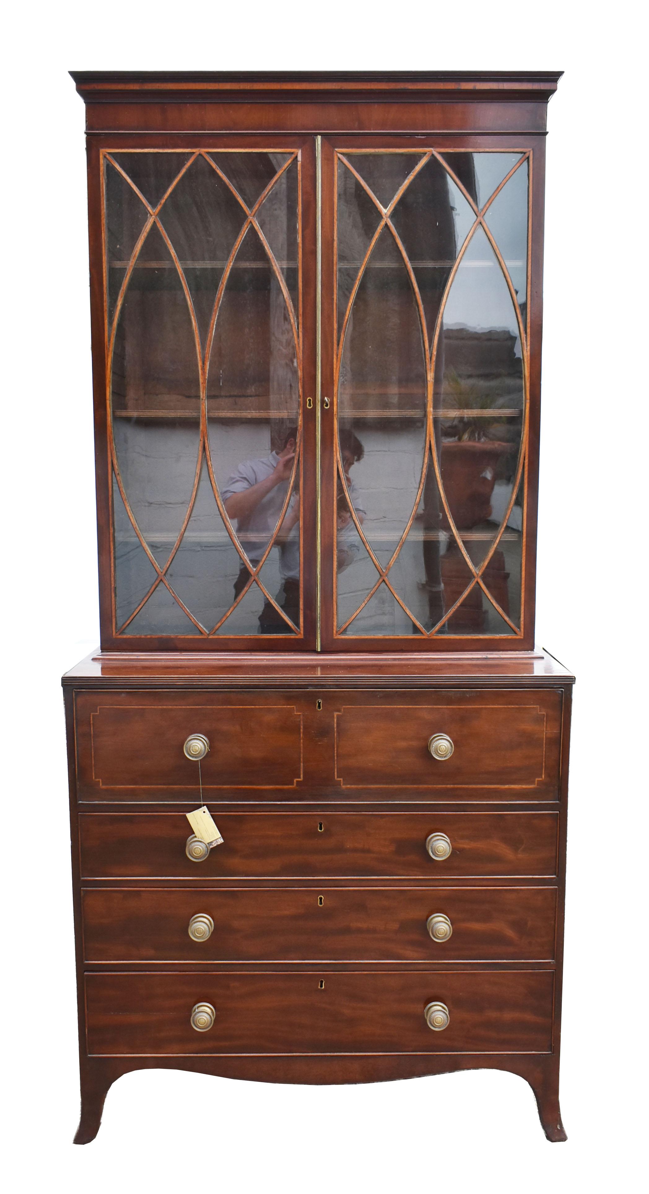For sale is a fine quality George III mahogany secretaire bookcase, having two glazed doors, each with satinwood veneered elliptical glazing bars, opening to reveal three adjustable shelves. Below this, the secretaire drawer, having a fall front,