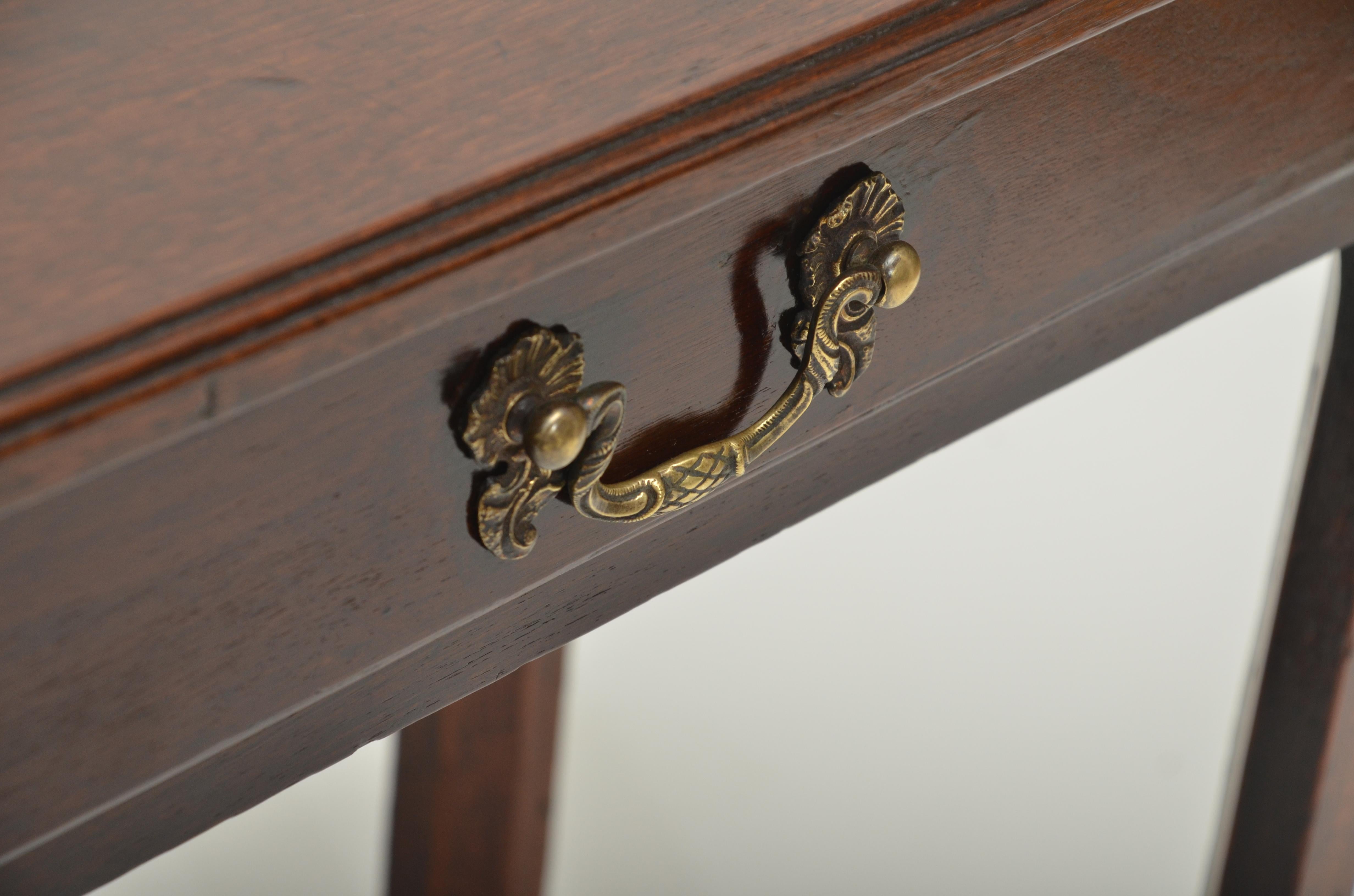 Single frieze drawer, square cut chamfered legs, molded edge top and original handle.