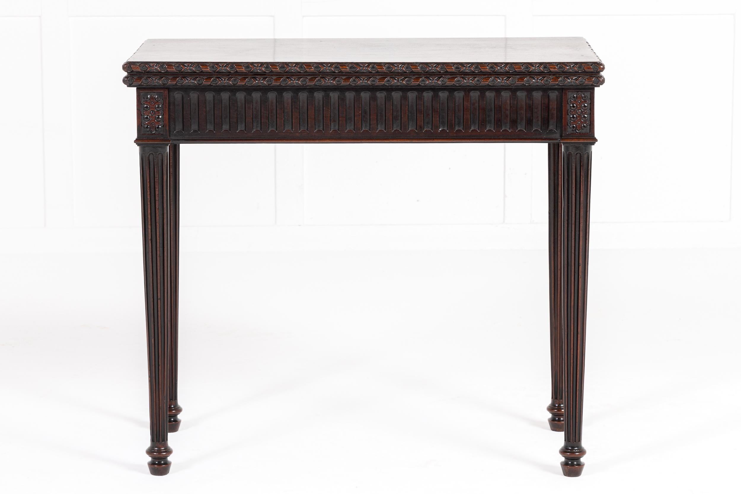 A Beautifully Carved English George III Period Mahogany Tea Table.

This fine table opens on a single gate leg mechanism, meaning that one of the back legs swings out of the table frame to support the top. The table is made from the highest grade of
