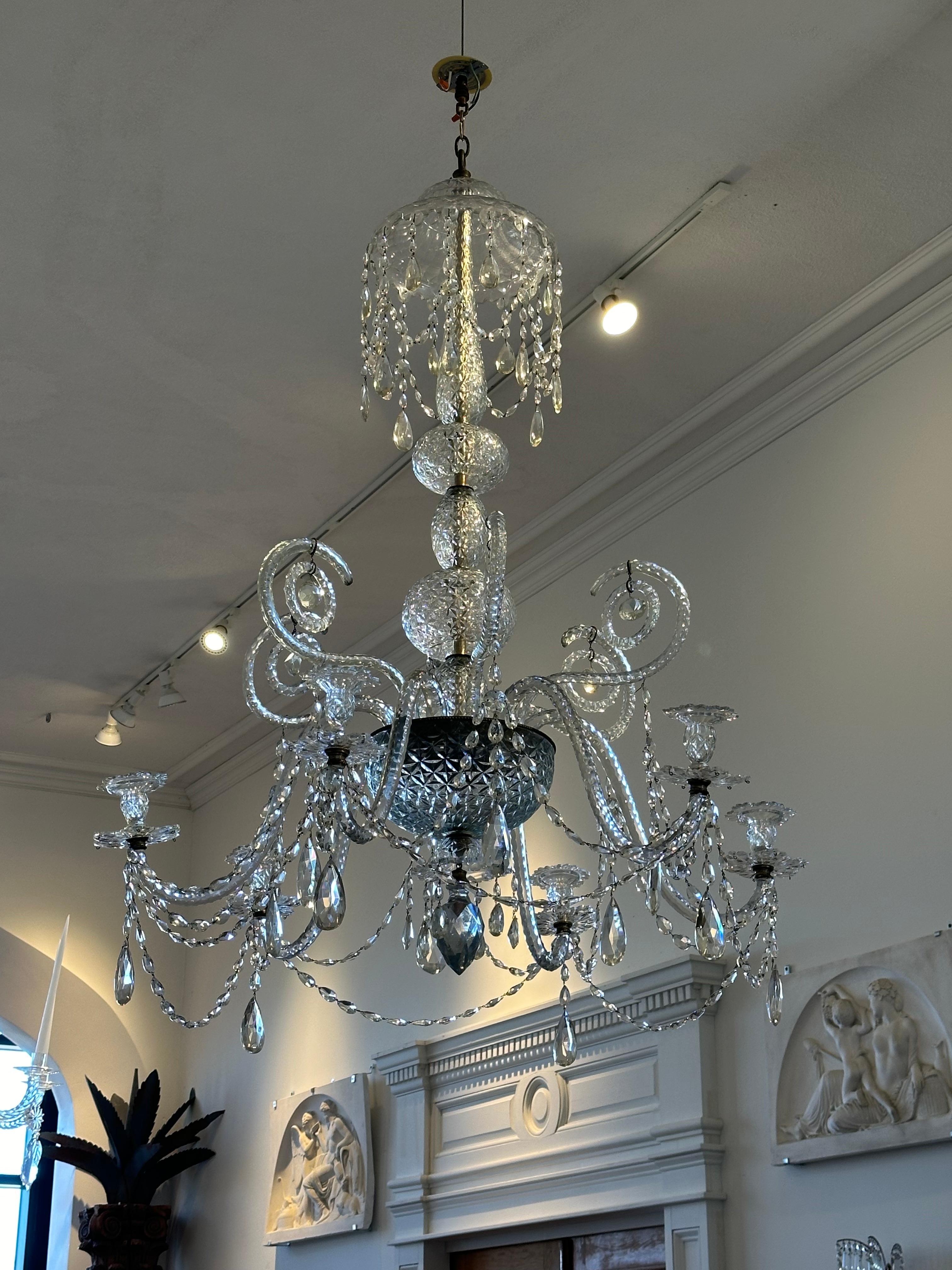 18th century Georgian cut crystal chandelier of large scale and wonderful design. Original crystal exhibiting greyish color quality from production in Derby during the 18th century (also known as Derby Blue in the 18th century).