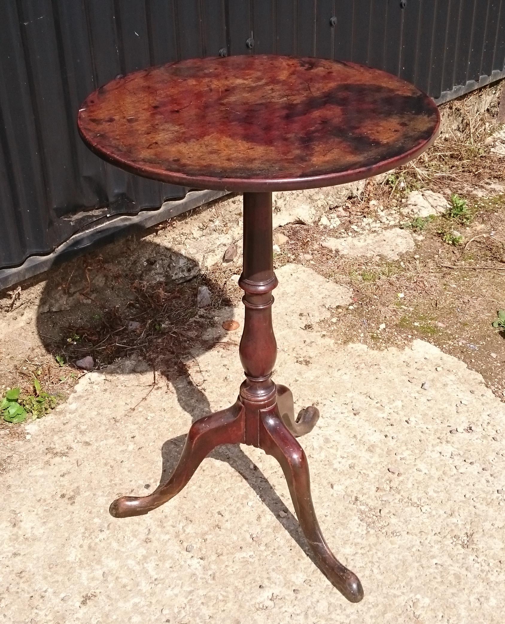 18th century George III period mahogany antique tripod wine table. This table is a wonderful color and has an excellent patina. The base is slender and elegant with outstretched tripod base typical of the late 18th century period.
This table is