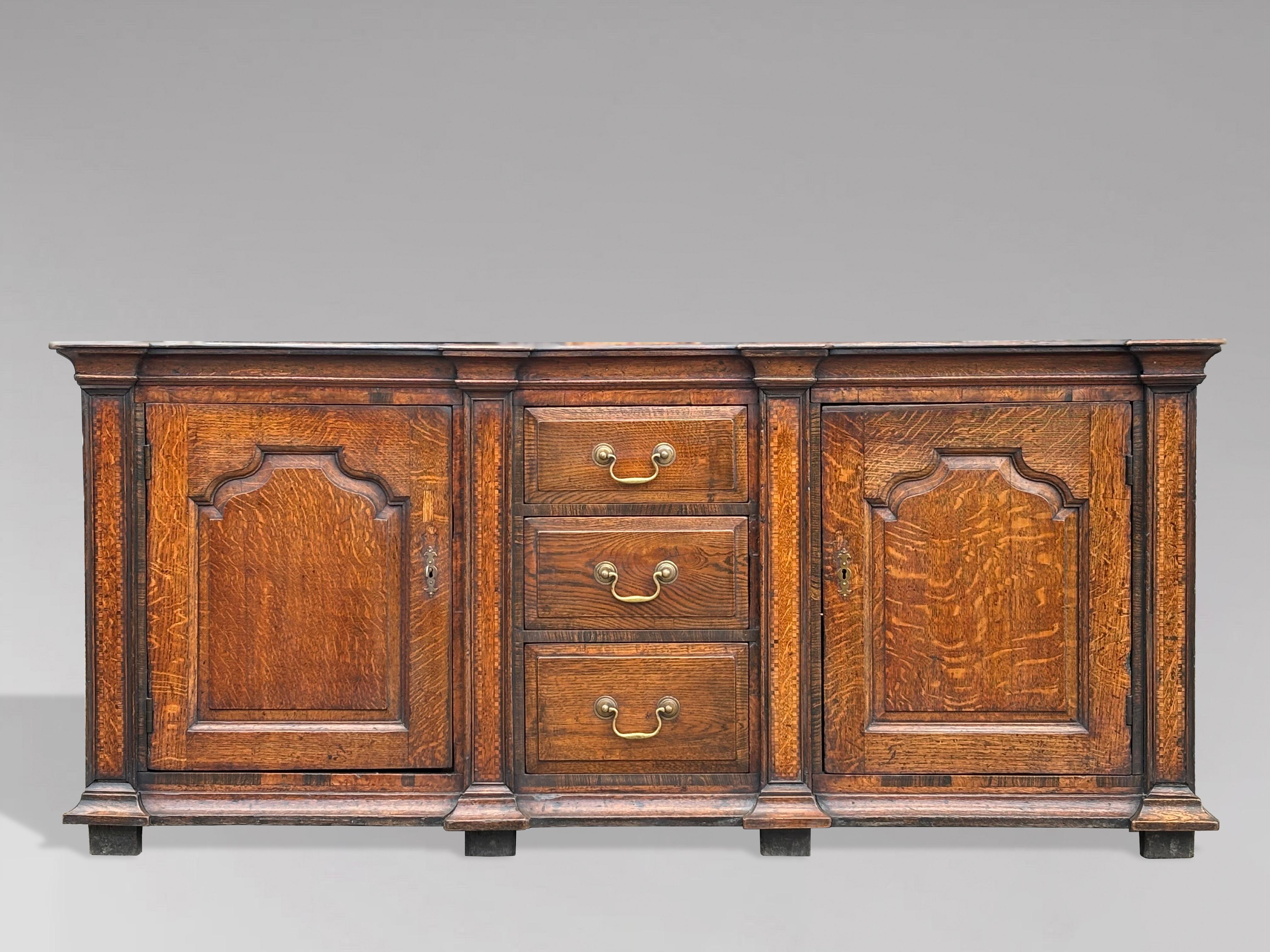 This late 18th-century Georgian solid oak dresser base is a stunning example of late Georgian craftsmanship, combining practical design with aesthetic appeal, and is a superb addition to any home.
The dresser base is distinguished by its rich patina