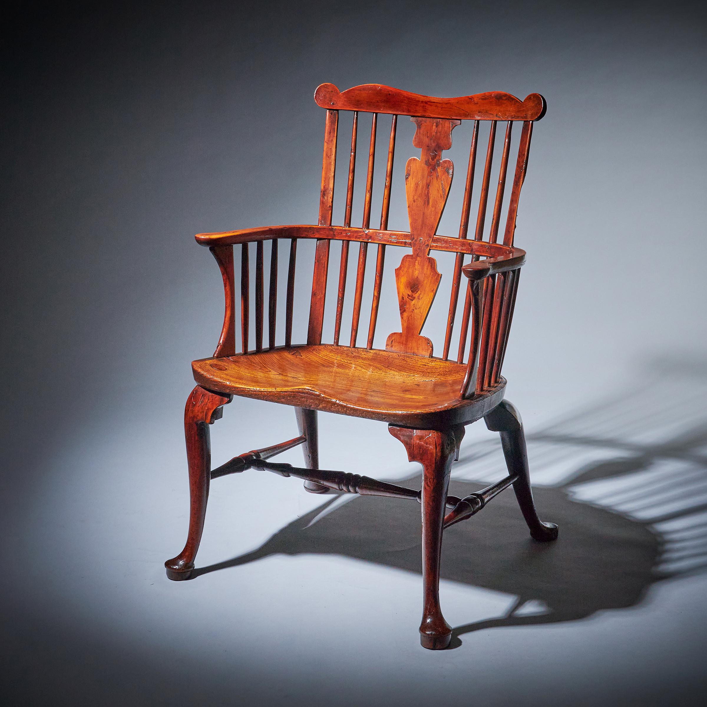 The exceptional and rare yew and elm comb-back Regional Windsor chair of large scale from the Thames Valley region, circa 1760. England
Attributed to John Pitt and Richard Hewitt.

The chair is incredibly comfortable and of generous proportions